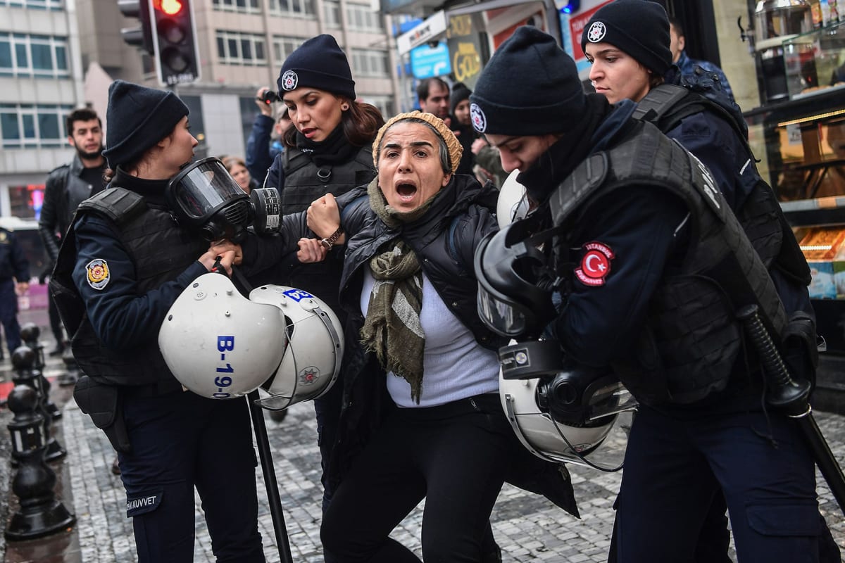 A woman reacts as Turkish anti-riot police officers arrest her during a demonstration called by Peoples’ Democratic Party (HDP) members to protest against Turkey’s “Olive Branch” operation in Syria in Istanbul on January 21, 2018. 