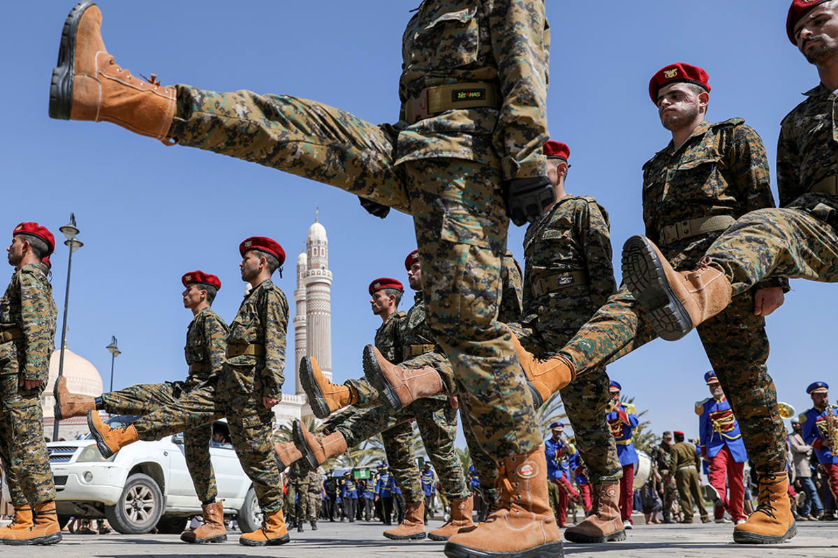 Houthi soldiers march during a funeral procession for Houthi fighters killed in recent fighting against government forces in Sana’a, Yemen, on February 17, 2021.