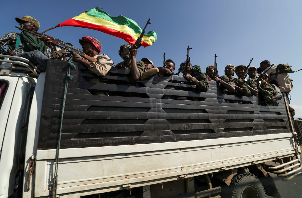 Amhara region militiamen ride on their truck as they head to face the Tigray People’s Liberation Front (TPLF) in Sanja, Amhara region, near the border with Tigray, Ethiopia, on November 9, 2020. 