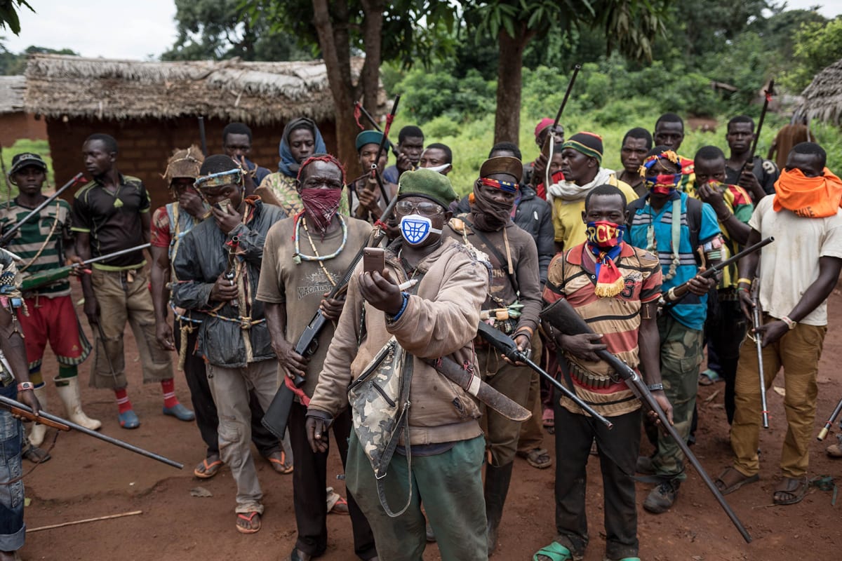 Anti-balaka combatants patrol in the parish of Gambo, southeastern Central African Republic on August 16, 2017. 