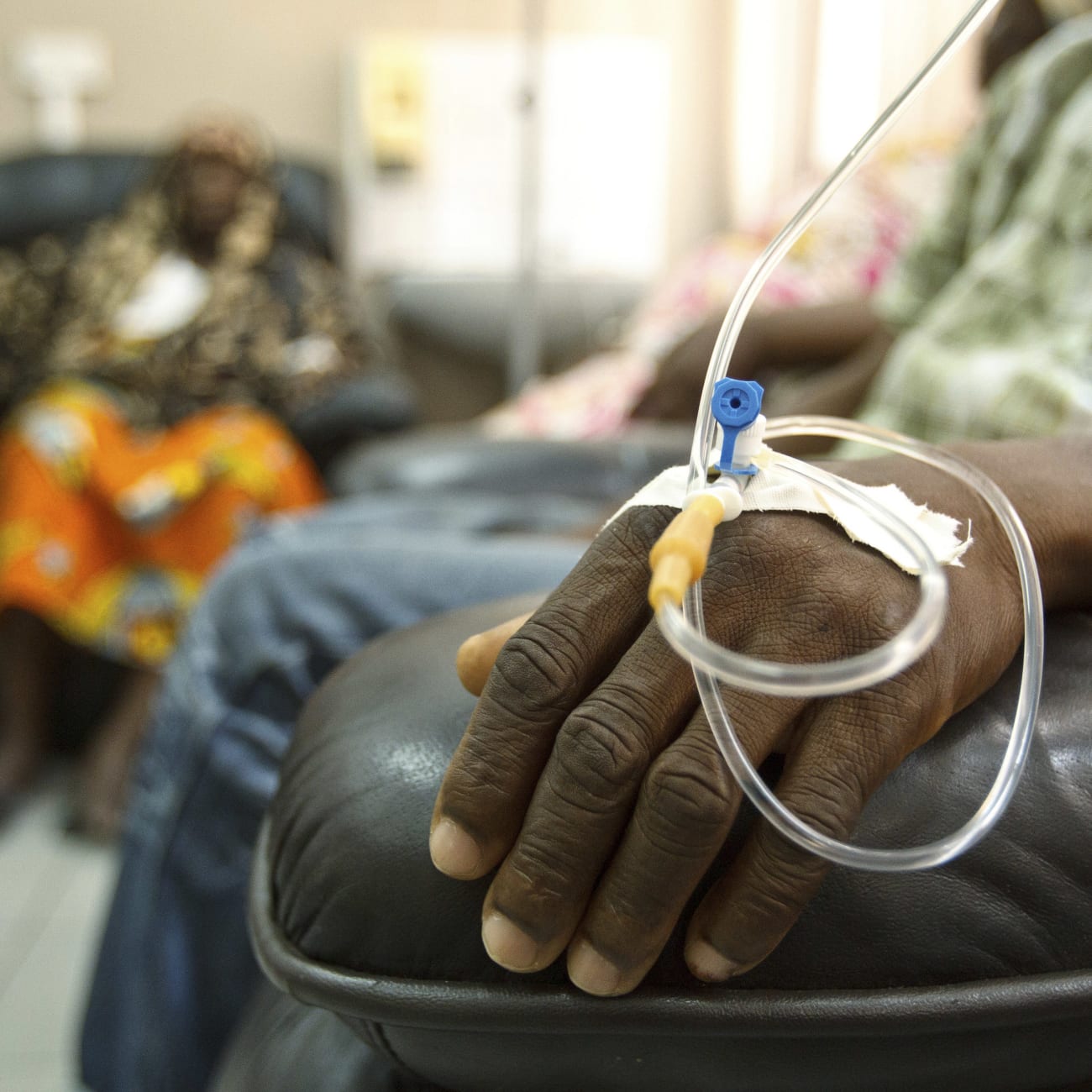 Cancer patients sit in a chemotherapy while receiving treatment at the Korle Bu Teaching Hospital, in Accra, Ghana, on April 24, 2012.