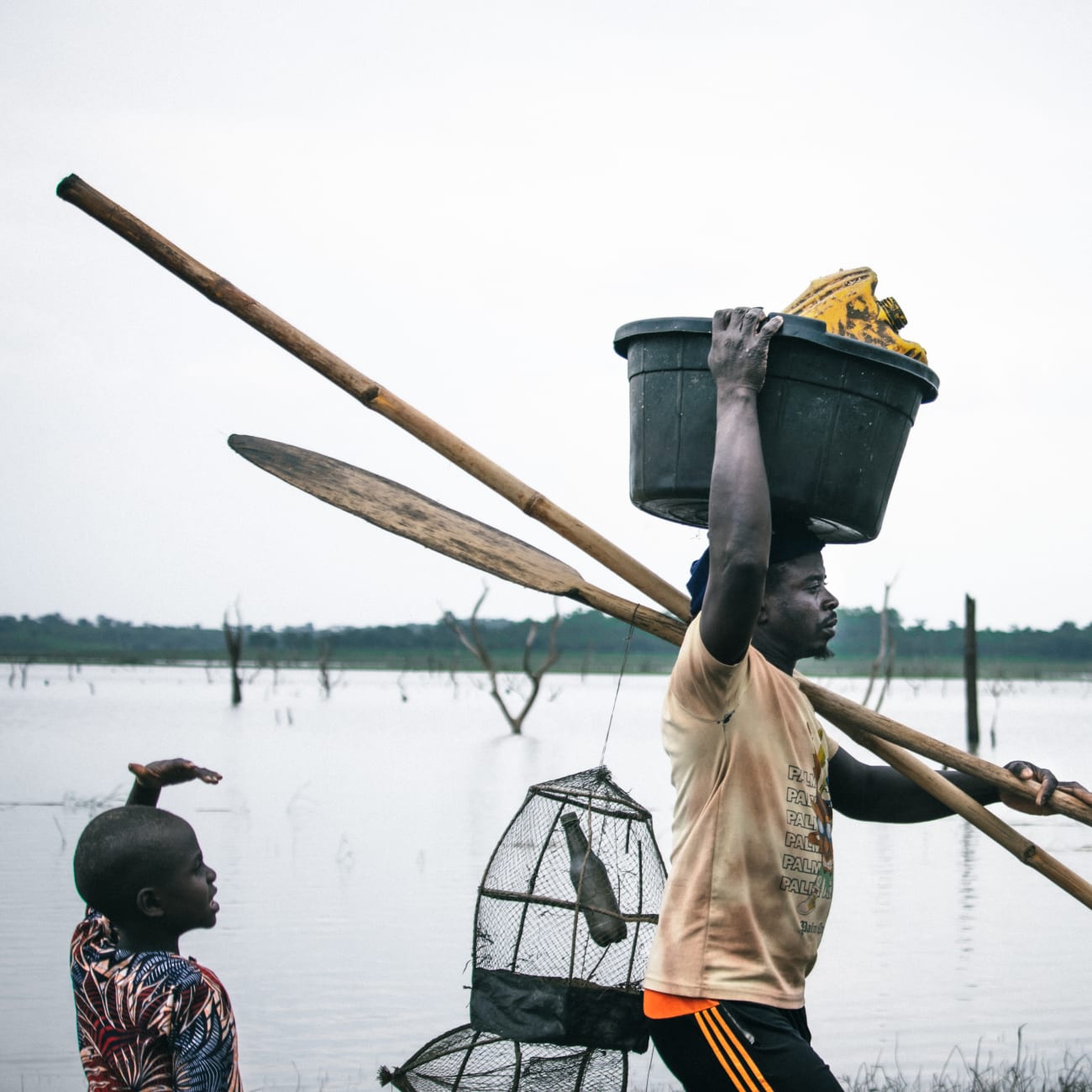 Fishermen are seen at the Oyan River, on July 2025.