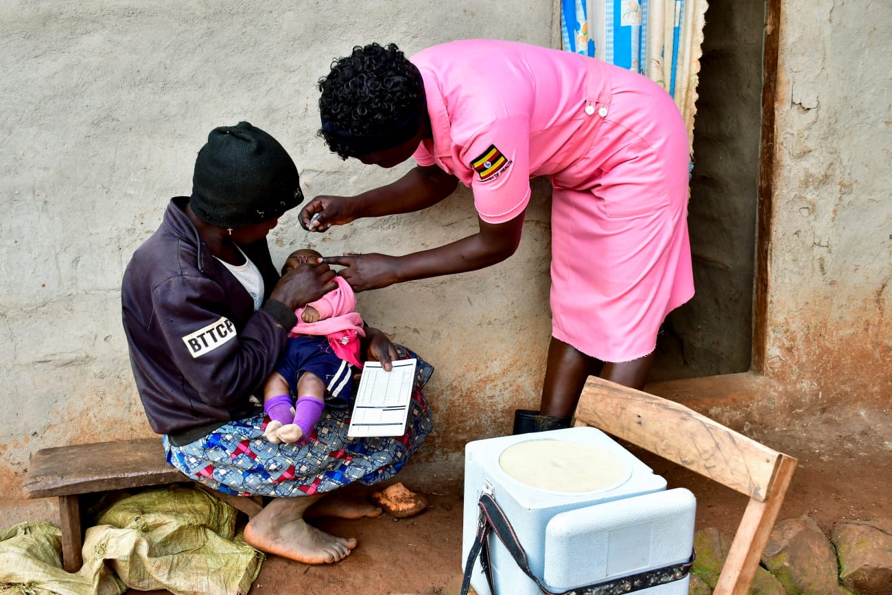A nurse administers polio vaccine to a child during her community outreach program, in Mushelusi village, in Bulambuli district, Uganda, on September 10, 2025.