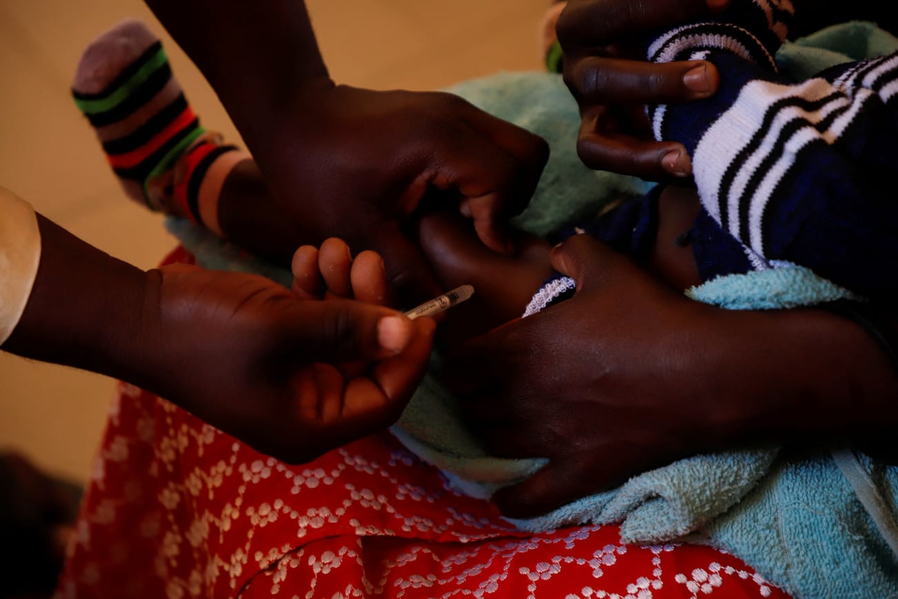 A nurse administers a malaria vaccine to an infant at the health center in Datcheka, Cameroon January 22, 2024. REUTERS/Desire Danga Essigue