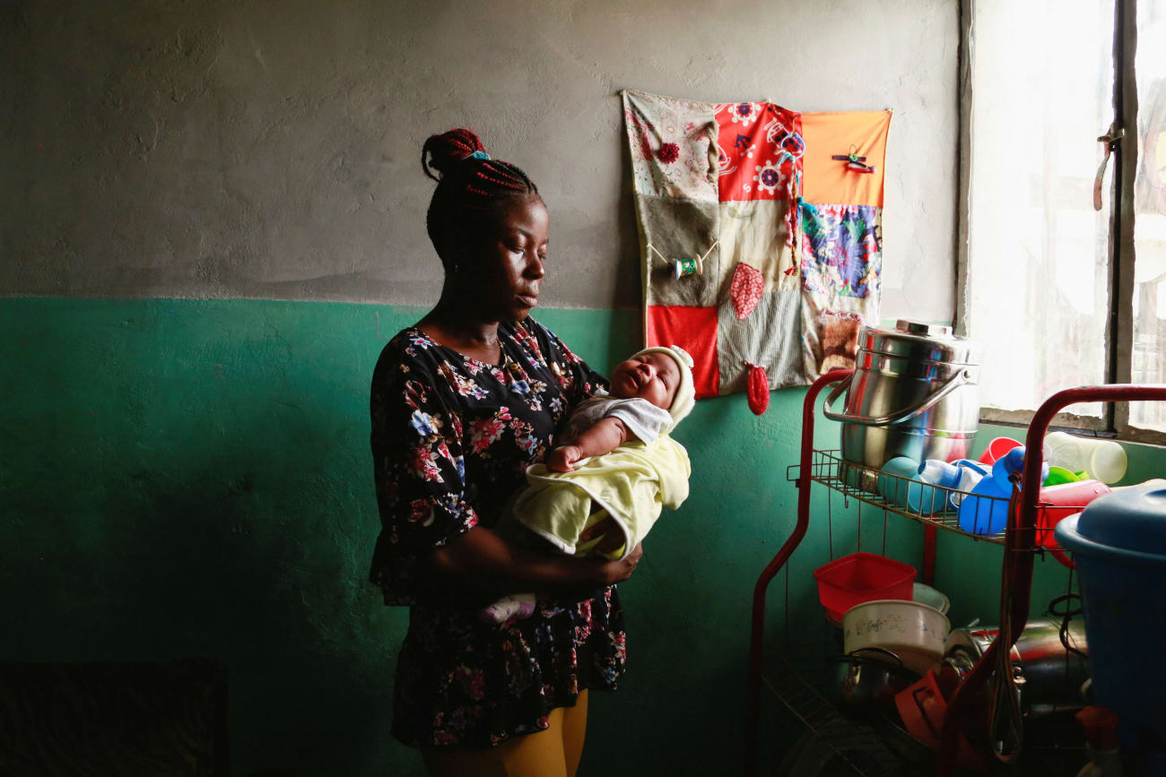 Jocelyne Mitoba, who was detained for 8 days with her baby for lack of money at Bethesda Medical Center, holds her newborn at her home, in Ngaba, a neighborhood of Kinshasa, Democratic Republic of Congo, on February 18, 2023.