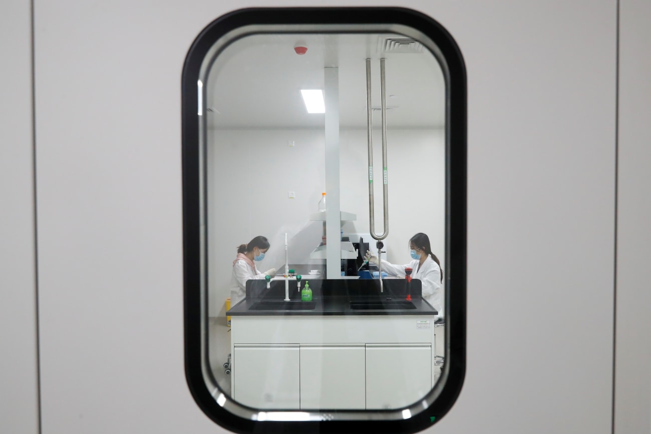 Women work in a laboratory of Chinese vaccine maker Sinovac Biotech, developing an experimental COVID-19 vaccine, during a government-organized media tour, in Beijing, China, on September 24, 2020.