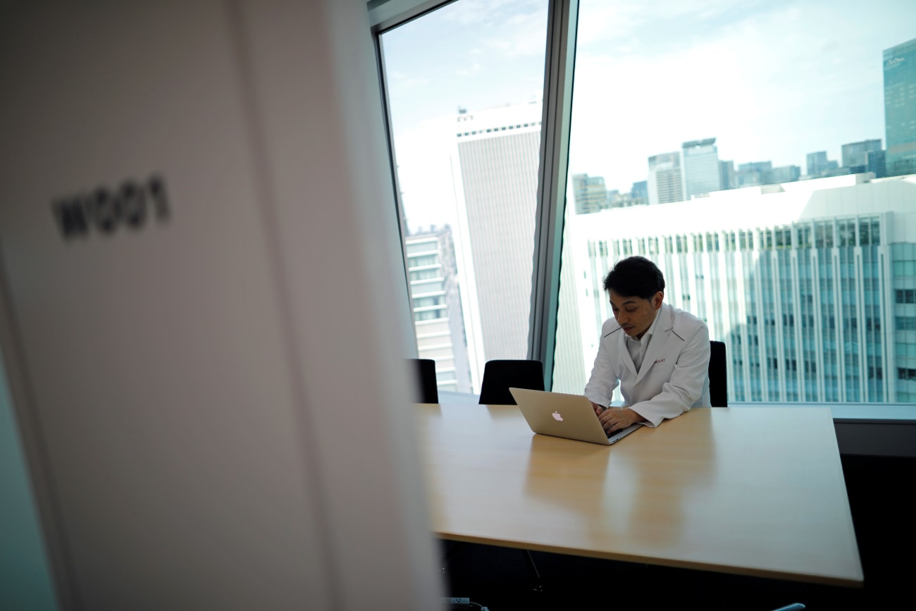 Makoto Kitada, MD, demonstrates a telemedicine application service called 'CLINICS,' in Tokyo, Japan, on July 8, 2020.