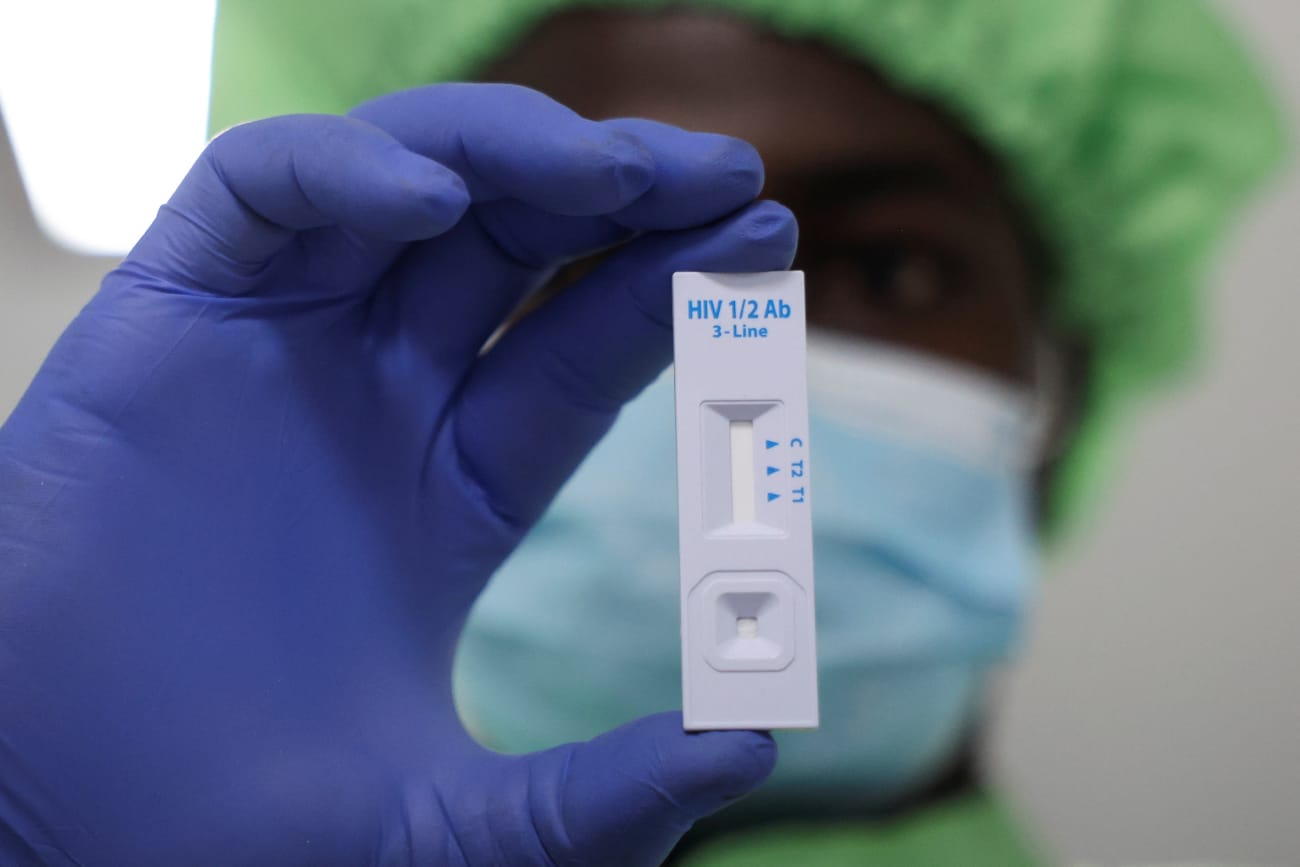 A worker displays a plastic test cassette for HIV 1/2 at Codix Bio production plant where HIV and Malaria test kits are locally produced, as it aims to fill the gap left by U.S. funding cuts to USAID, in Iperu-Remo in Ogun State, Nigeria, on June 18, 2025.