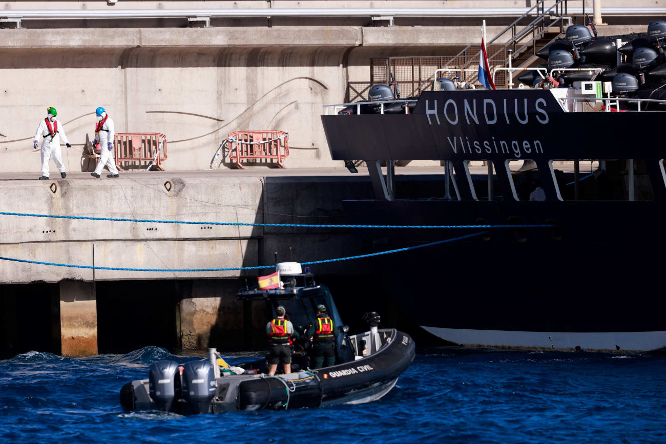 Civil guard members approach the cruise ship MV Hondius, affected by a hantavirus outbreak, on a motorboat, at the port of Granadilla de Abona, Tenerife, Spain, on May 11, 2026.