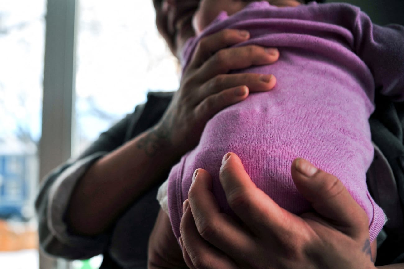 A woman holds her baby at the Sanctum Hospice and Care Home, in Saskatoon, Saskatchewan, Canada, on January 26, 2023.