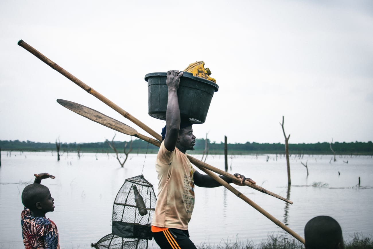Fishermen are seen at the Oyan River, on July 2025.