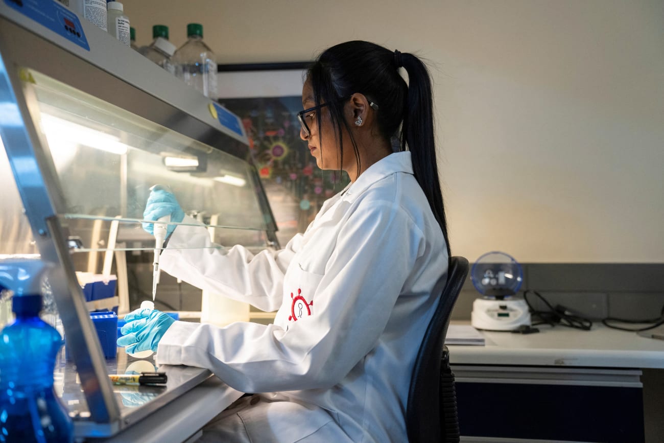 A medical laboratory technician at the Wits Antiviral Gene Therapy Research Unit, works in the research lab at the Wits University Faculty of Health Sciences, in Johannesburg, South Africa, on February 14, 2025.