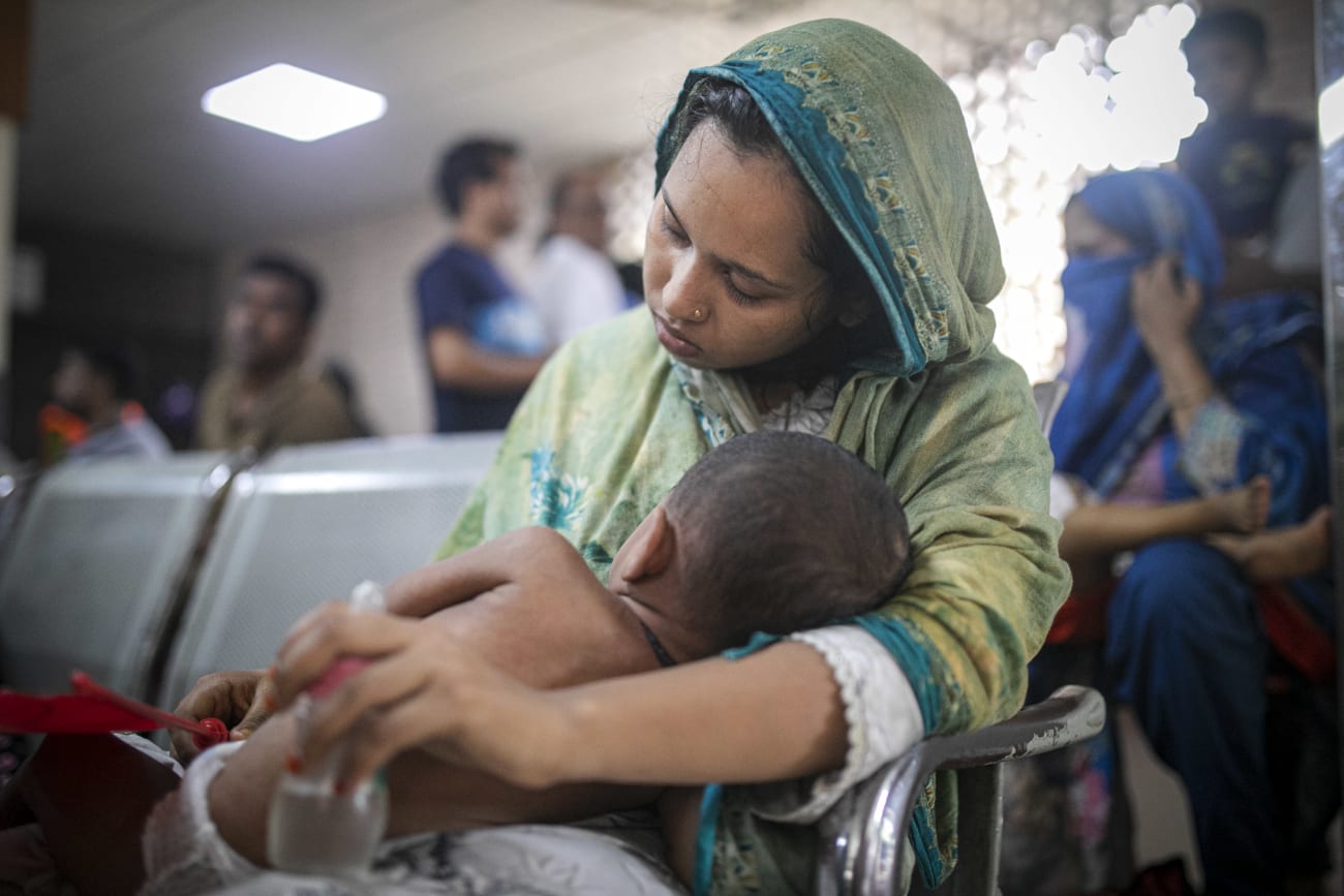 A mother waits to admit her measles‑affected child at Bangladesh Shishu Hospital in Dhaka, Bangladesh, on May 23, 2026.