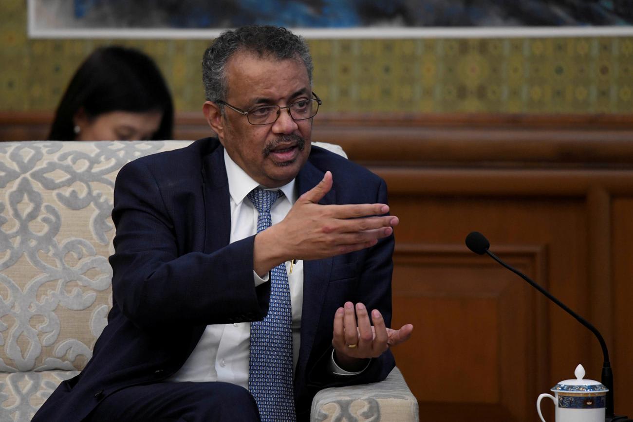 The photo shows Director-General Tedros talking and gesturing with his hands.