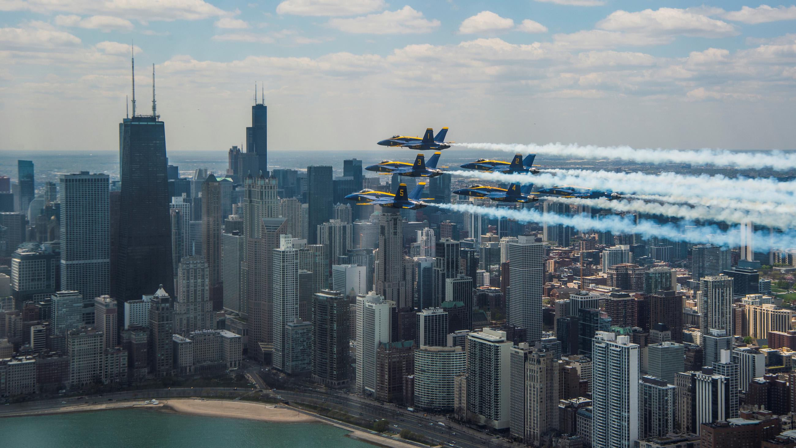 Picture shows the military jets flying over Chicago on a clear day.