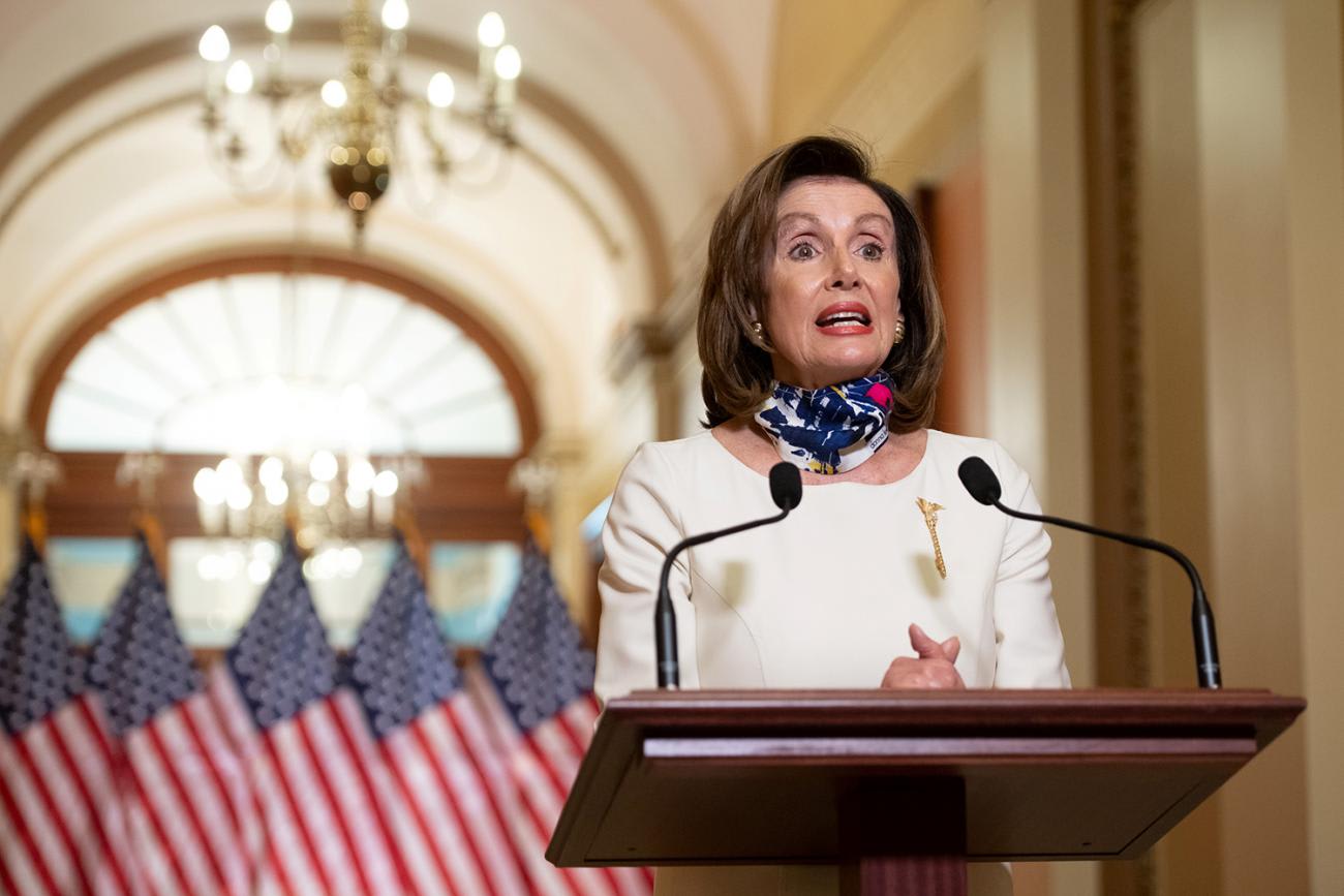 U.S. House Speaker Nancy Pelosi (D-CA) speaks about the 'Heroes Act', a proposal for the next phase of the coronavirus disease (COVID-19) relief legislation, in Washington, DC, on May 12, 2020. The photo shows the speaker at a podium standing in front of American flags speaking.