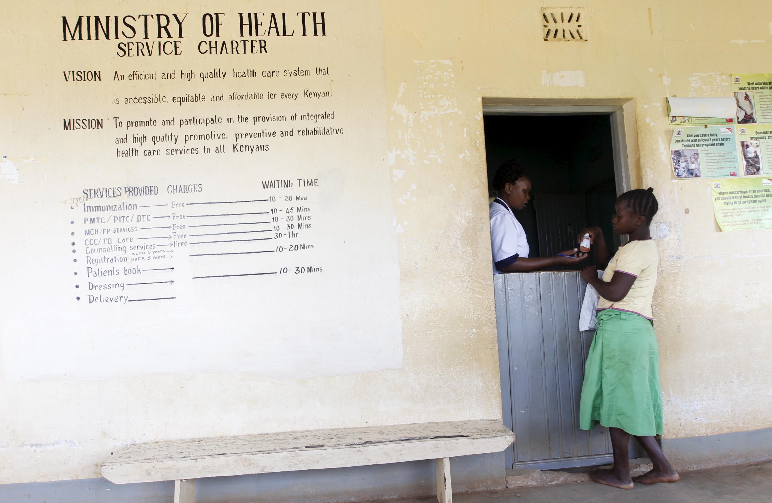 A patient collects medicine at the Kogelo Dispensary in the village of Nyang'oma Kogelo, in Kenya, on July 16, 2015.
