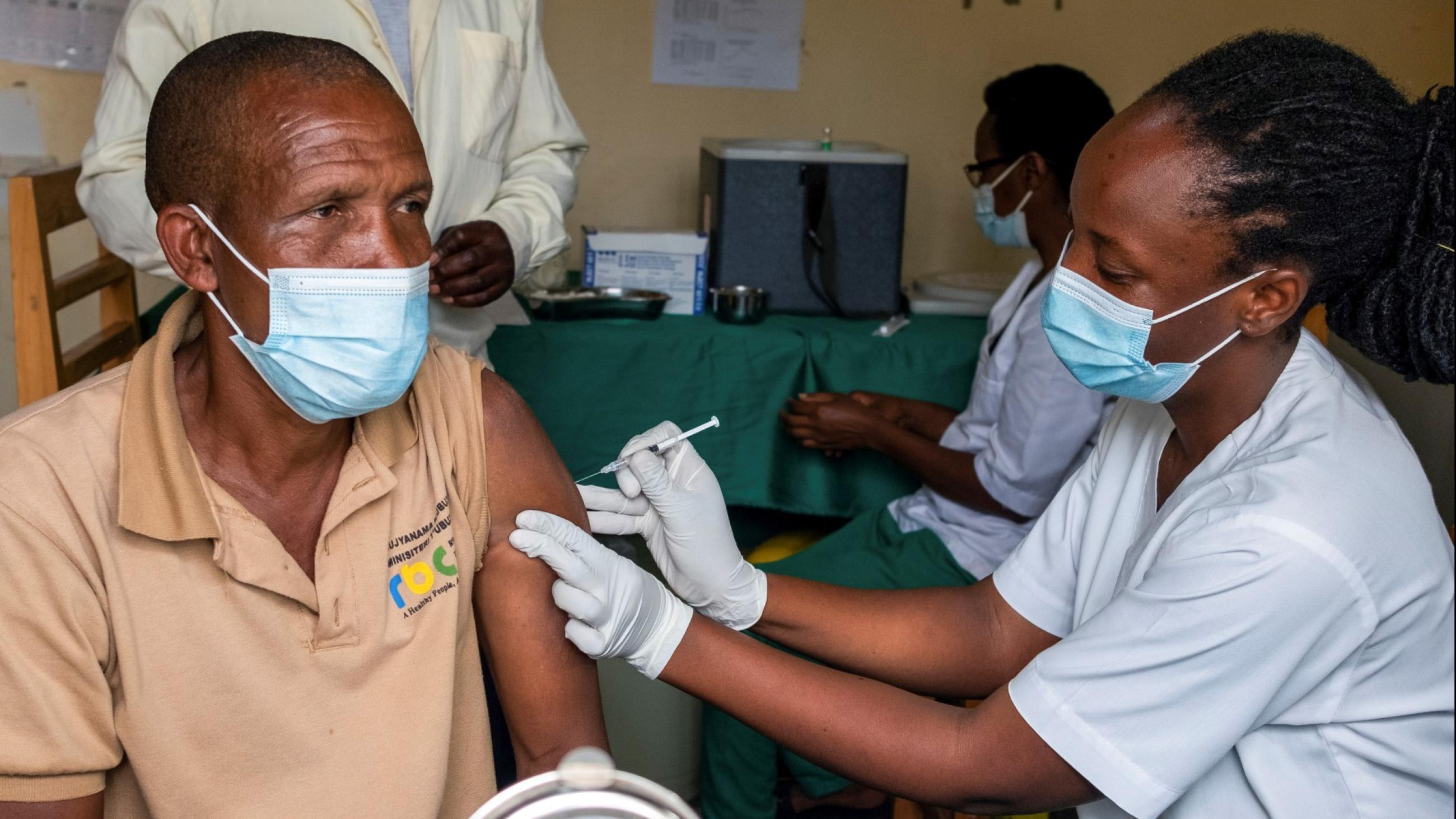 A man receives a vaccine against the coronavirus disease (COVID-19) at the Masaka hospital in Kigali, Rwanda, on March 5, 2021.