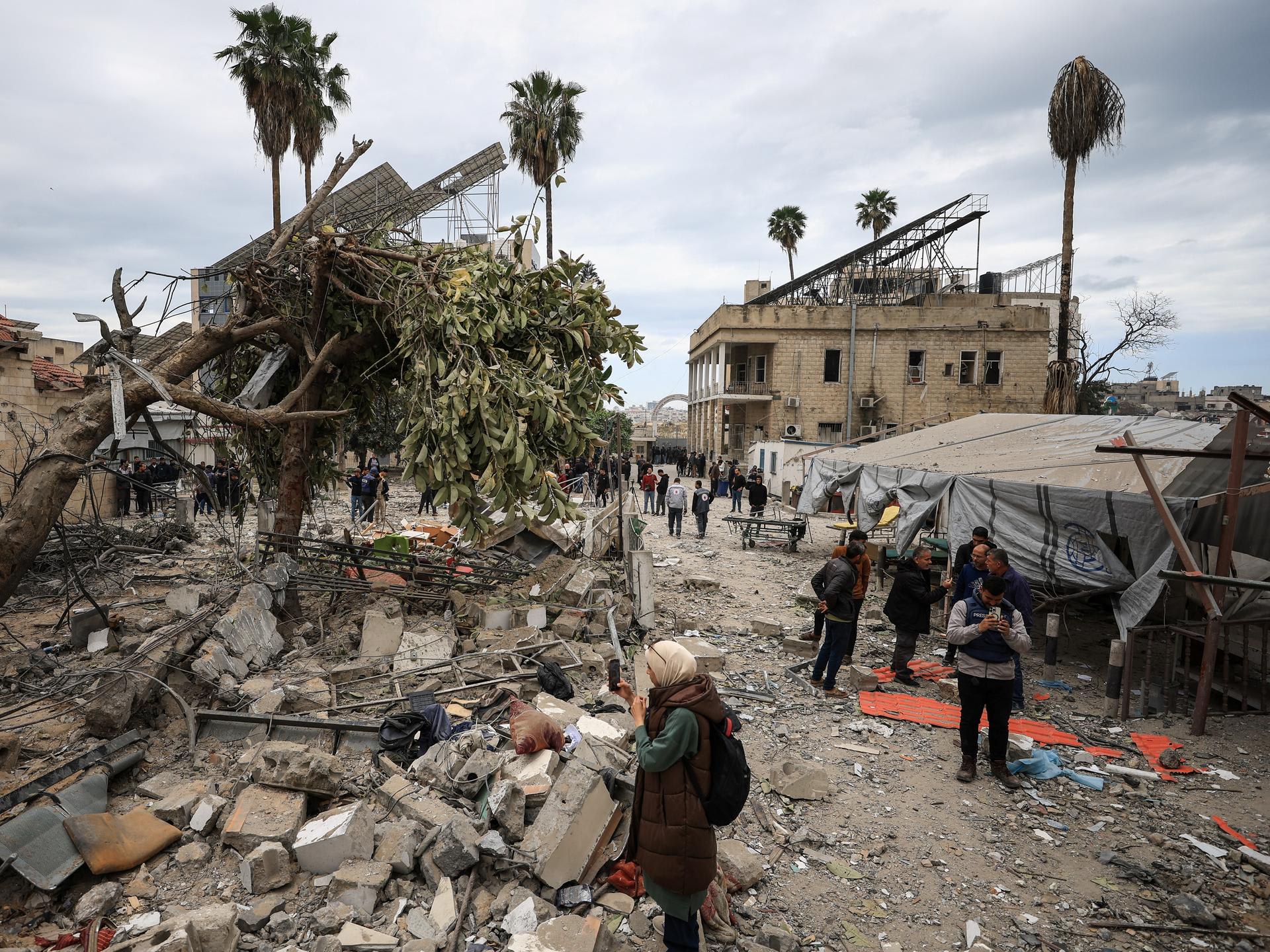 Palestinians inspect the damage after two Israeli missiles hit a building inside the Al-Ahli Arab Baptist Hospital, in the Gaza Strip, on April 13, 2025.t the liquid oxygen storage tank installed at Bir Hospital by the United States Agency for International Development, in Kathmandu, Nepal, on February 9, 2025.