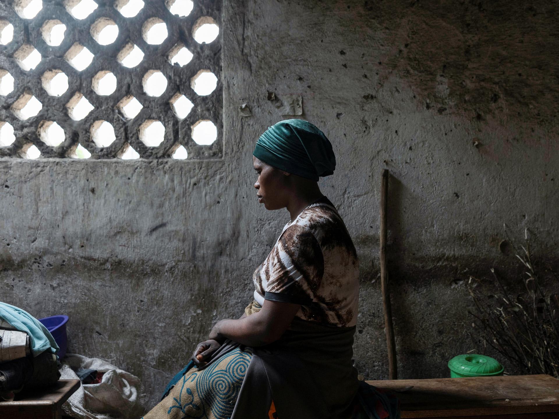 Florence Mushimye poses for a portrait in a classroom where they are taking refuge after being asked to leave Kalenga village by the M23 rebels, in Sake, eastern Democratic Republic of Congo, on March 13, 2025.