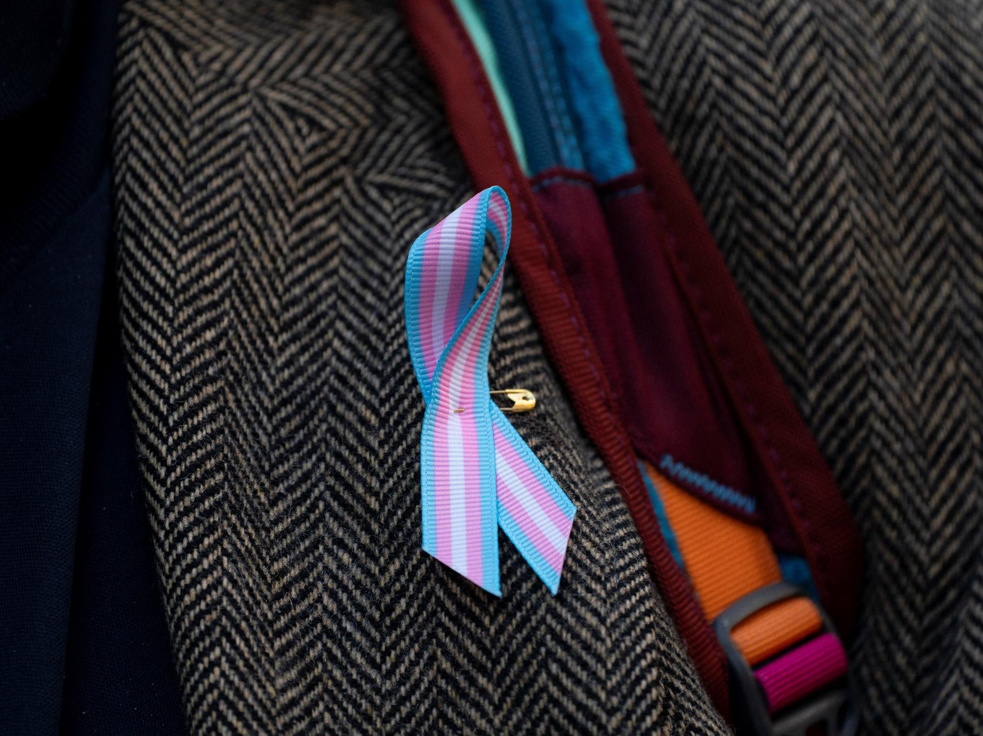 A supporter wears a pro-trans ribbon, in Seattle, Washington, on February 28, 2025.