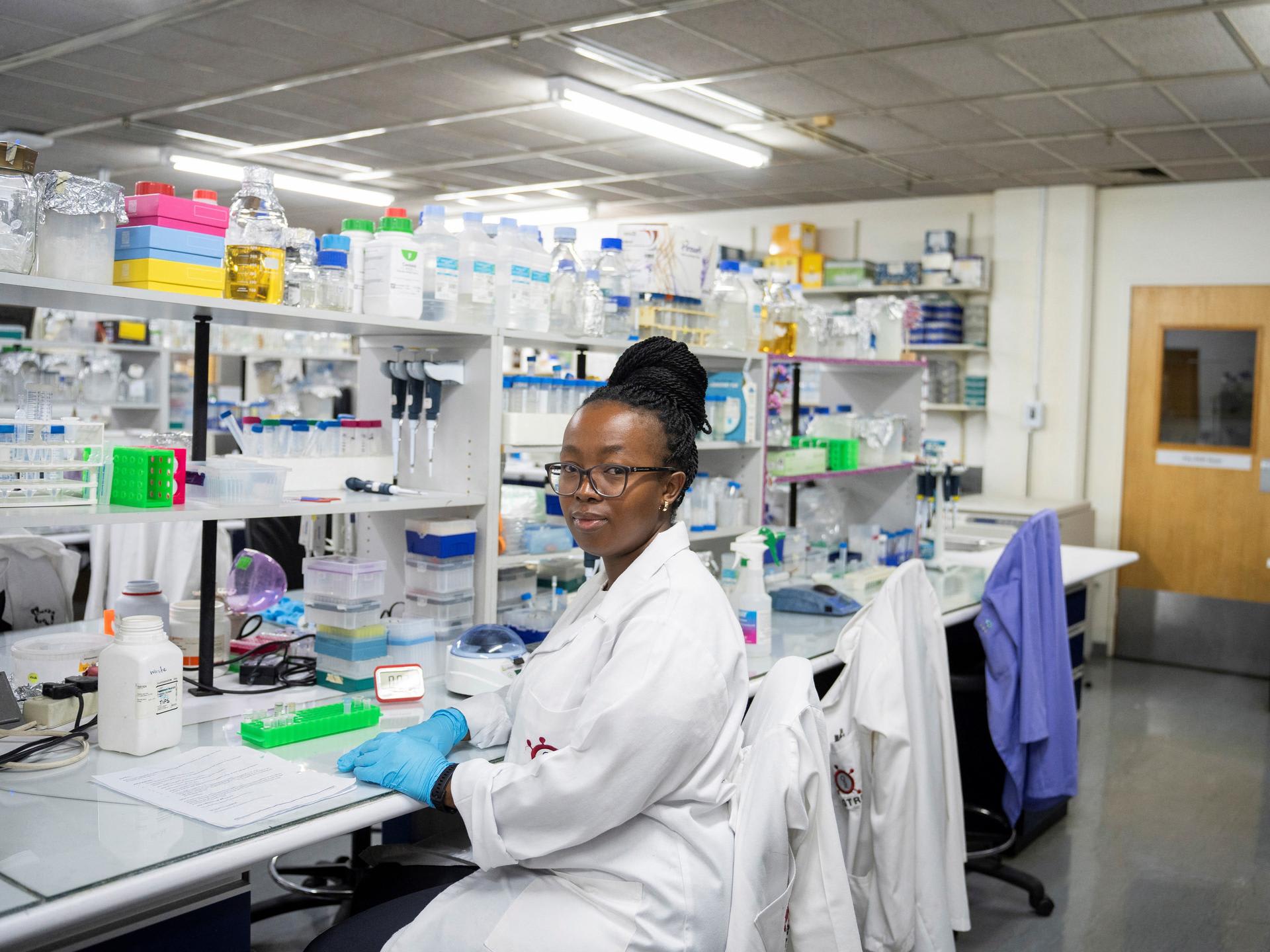 A medical laboratory technician at the Wits Antiviral Gene Therapy Research Unit poses for a portrait, in the research lab at the Wits University Faculty of Health Sciences, in Johannesburg, South Africa, on February 14, 2025.