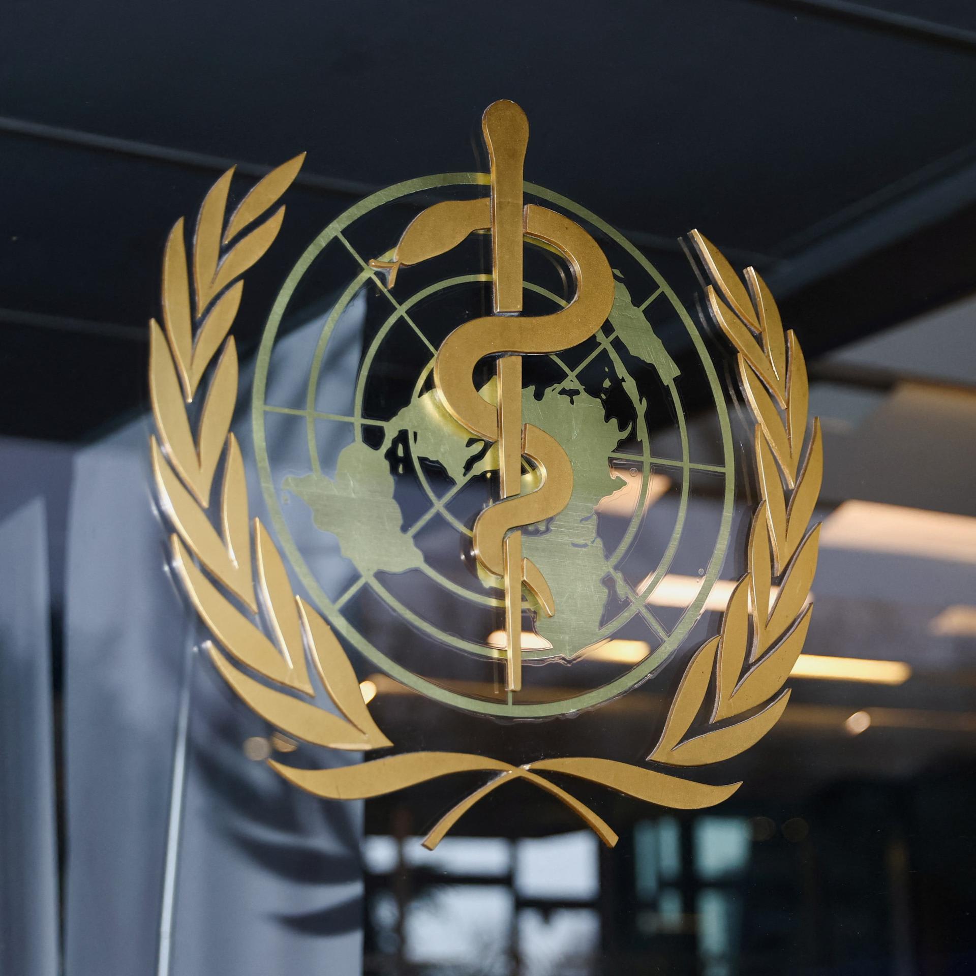 The World Health Organization (WHO) logo is pictured at the entrance of the WHO building, in Geneva, Switzerland, on December 20, 2021.