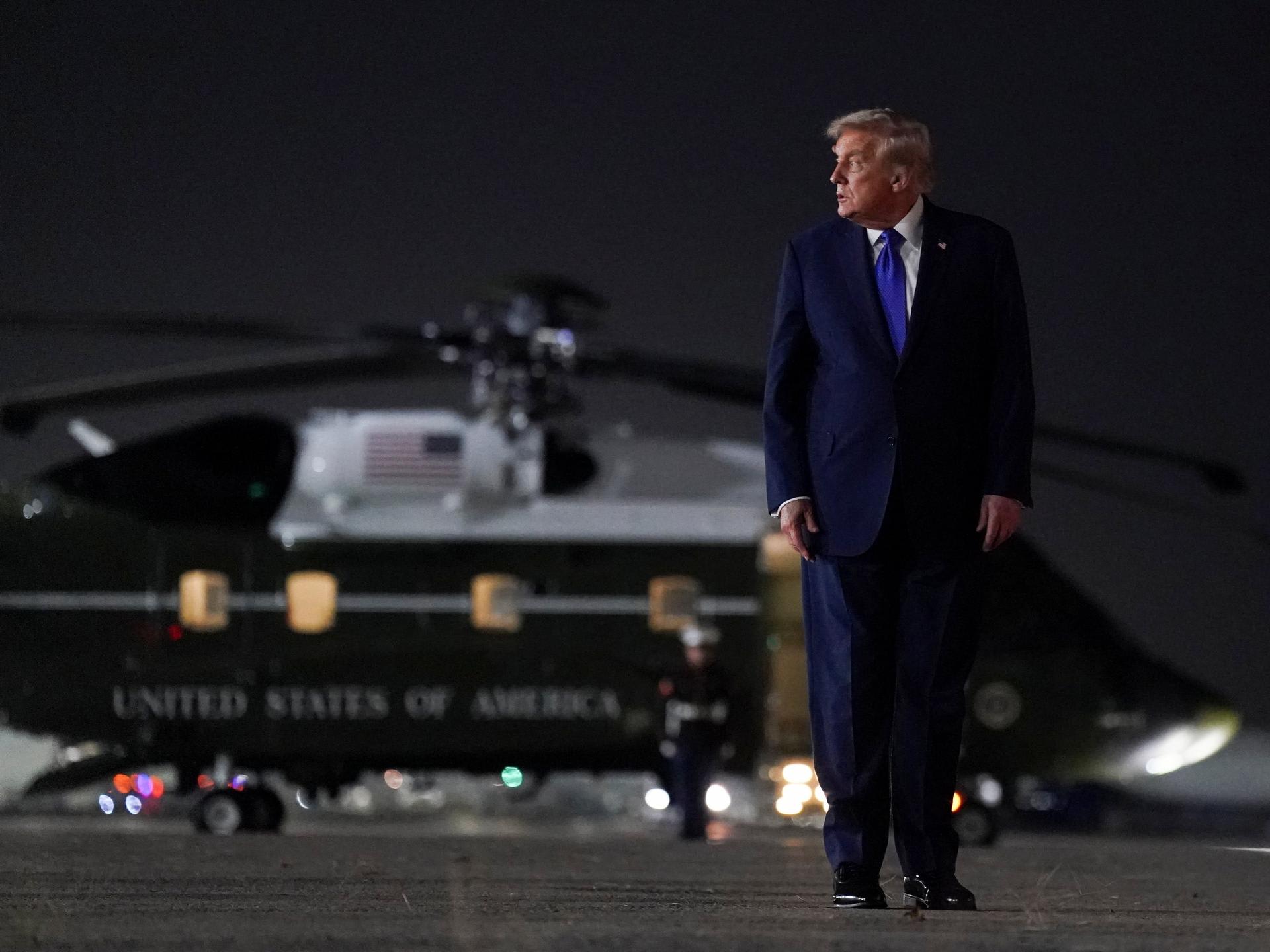 U.S. President Donald Trump looks on as he walks to board Air Force One, after attending the eightieth United Nations General Assembly, at John F. Kennedy International Airport, in New York, on September 23, 2025.
