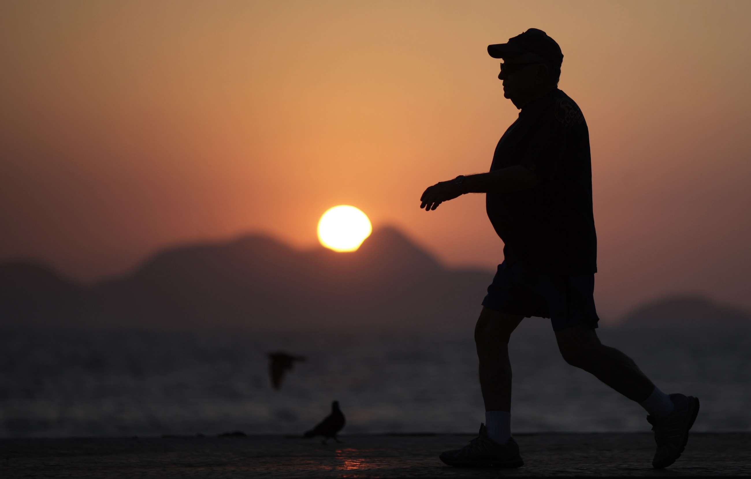 An elderly man walks in Copacabana in Rio de Janeiro September 13, 2011. World Bank data shows the growth rate of Brazil's older population as many times that of the most developed countries in Europe, projected to equal 14% of the population by 2033, while Copacabana has the largest number of retirees of any neighborhood in the country. Picture taken September 13, 2011.