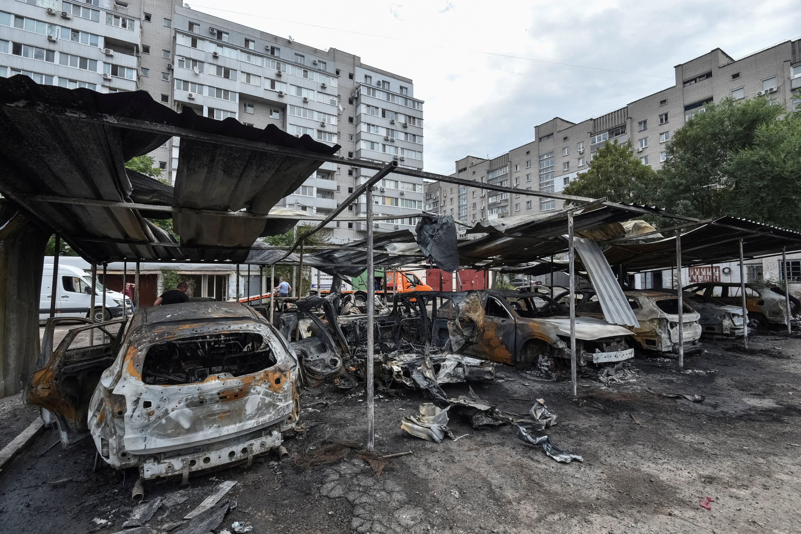 A view shows burned cars at the site of the Russian drone strike, amid Russia's attack on Ukraine, in Dnipro, Ukraine, on July 26, 2025.