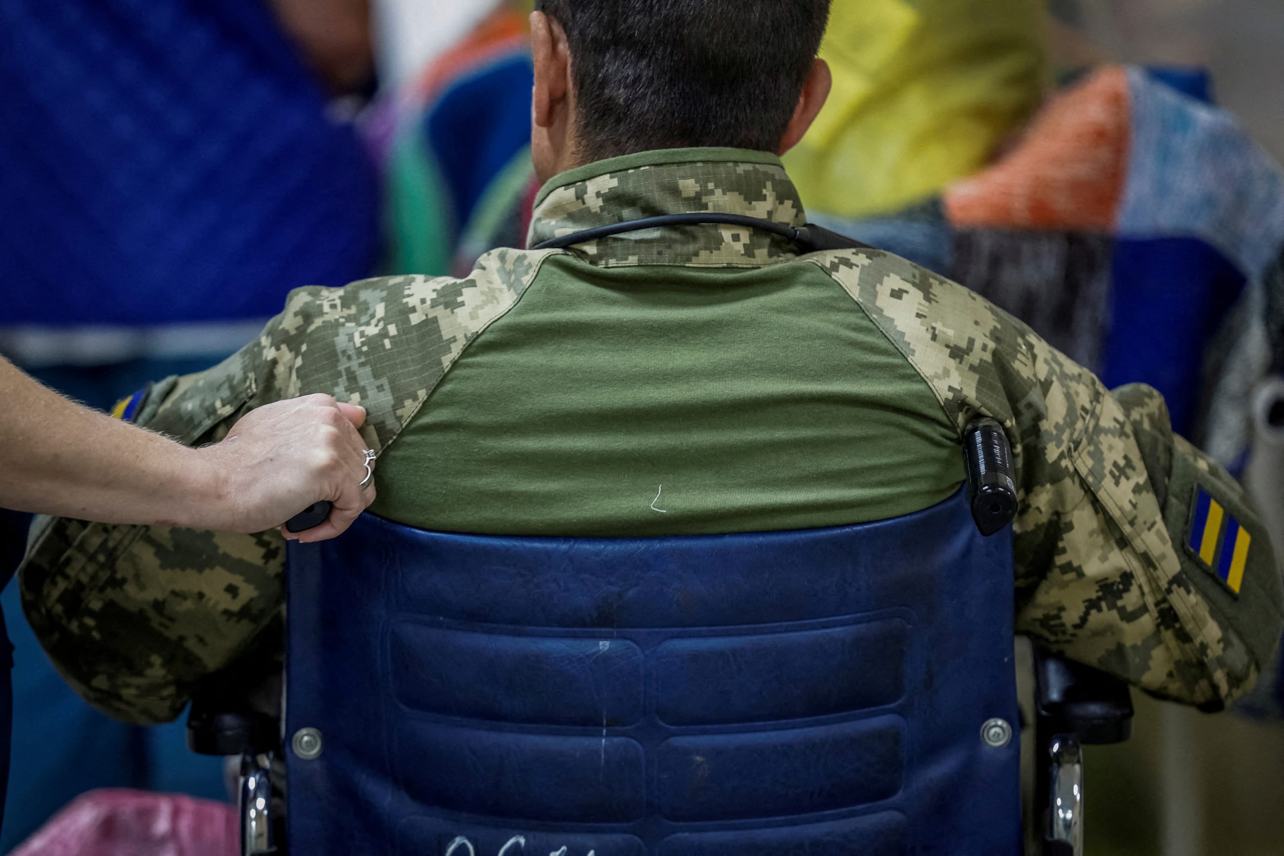 A Ukrainian serviceman, wounded during fighting with Russian forces, who is a patient of the Mechnikov Hospital, prepares for being transferred, amid Russia's attack on Ukraine, in Dnipro, Ukraine, on May 14, 2025.