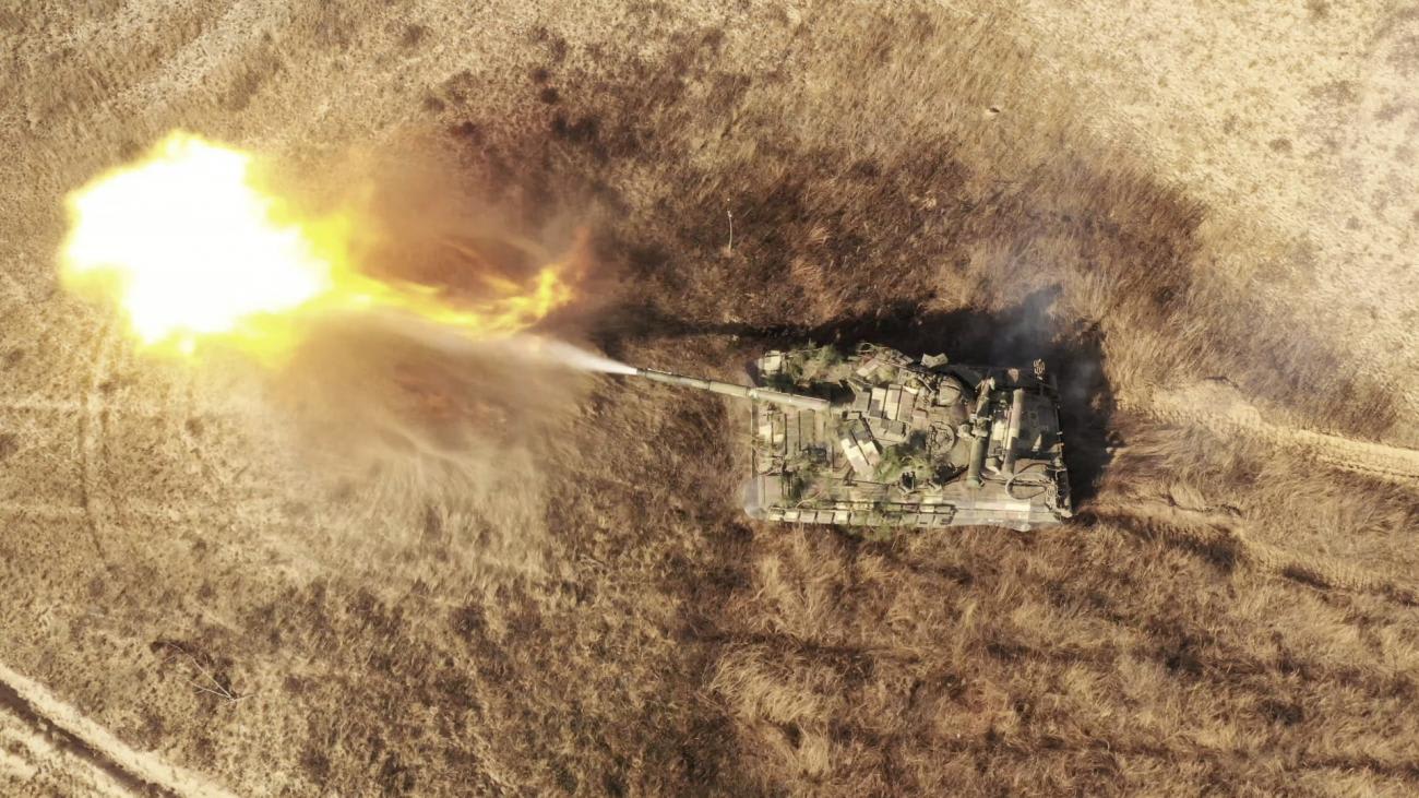 A Ukrainian Armed Forces tank fires during military drills at a training ground near the border with Russian-annexed Crimea, in the Kherson region of Ukraine, on November 17, 2021.