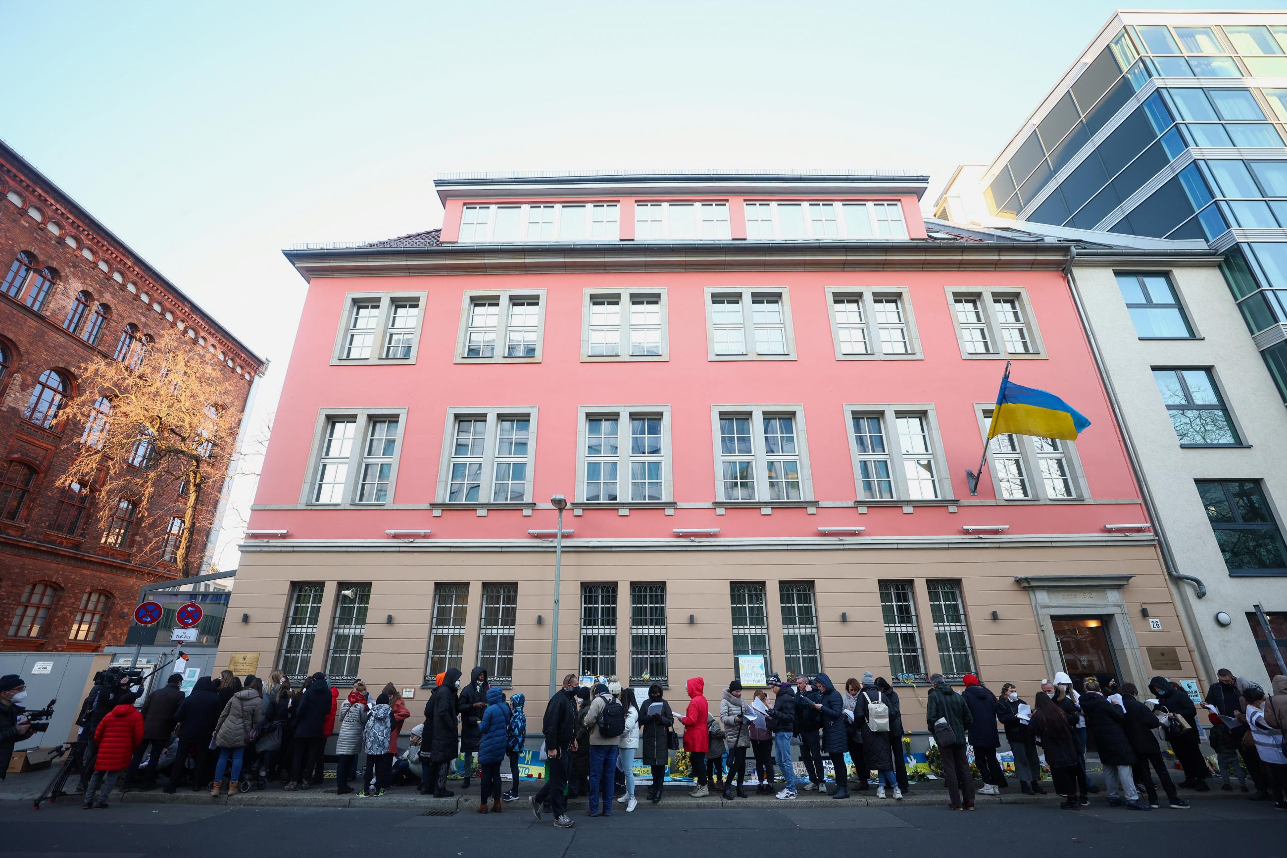 People who fled Ukraine during Russian attacks wait outside the Ukrainian Embassy in Germany to receive COVID vaccines, in Berlin on March 10, 2022.