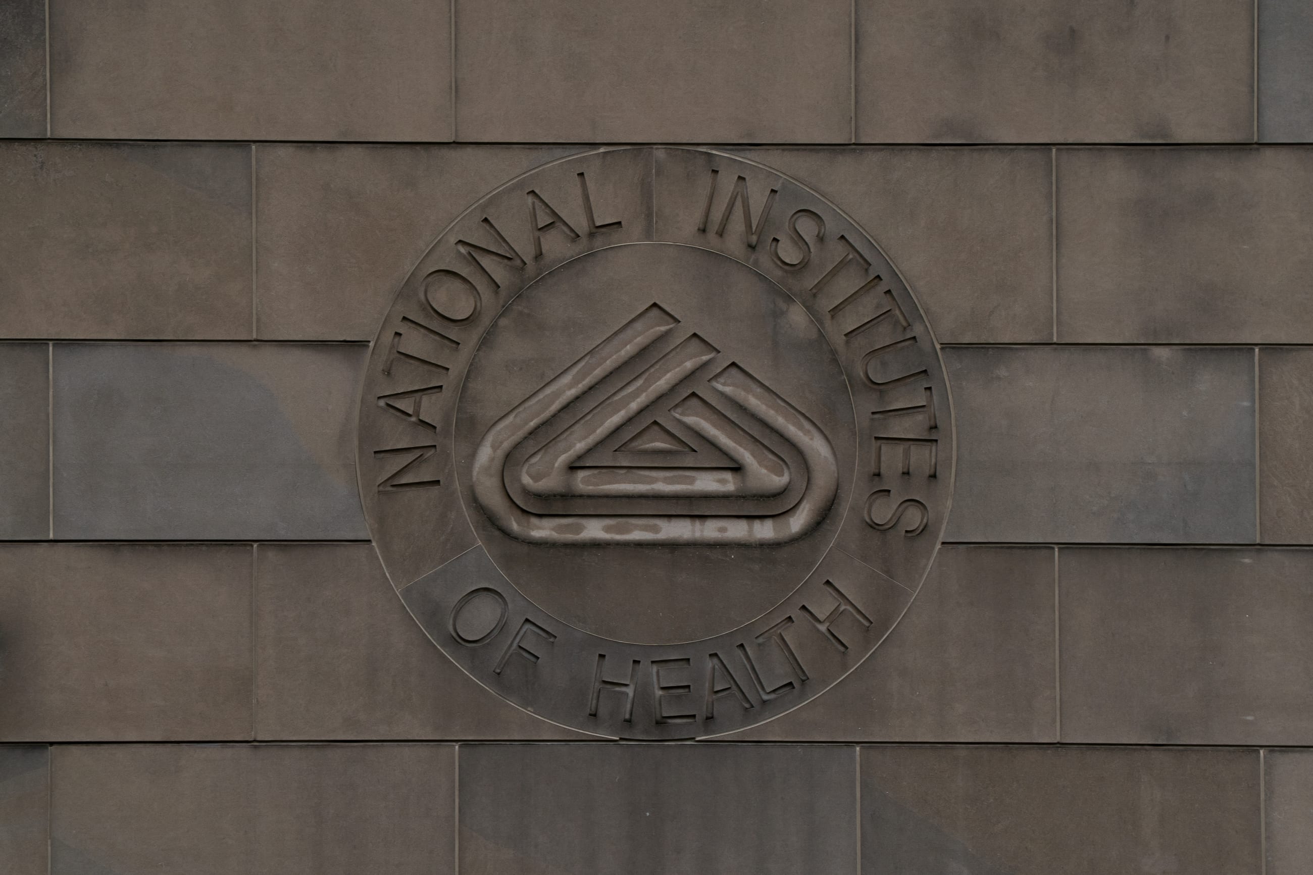 A view of the National Institutes of Health (NIH) logo at the National Institutes of Health Gateway Center, in Bethesda, Maryland, on June 8, 2025.