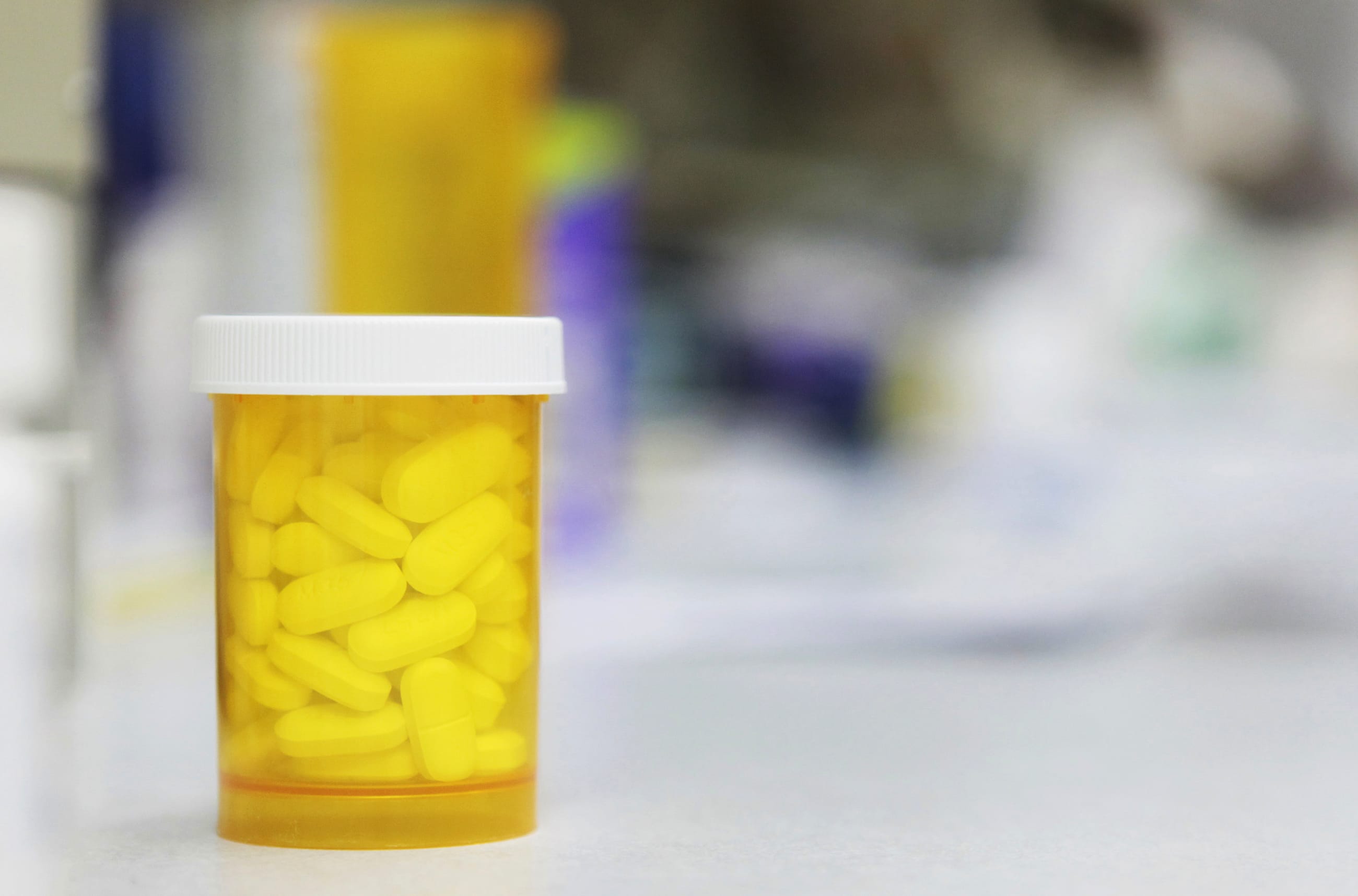 A bottle of prescription medication rests on a counter at a pharmacy, in New York, on December 23, 2009.