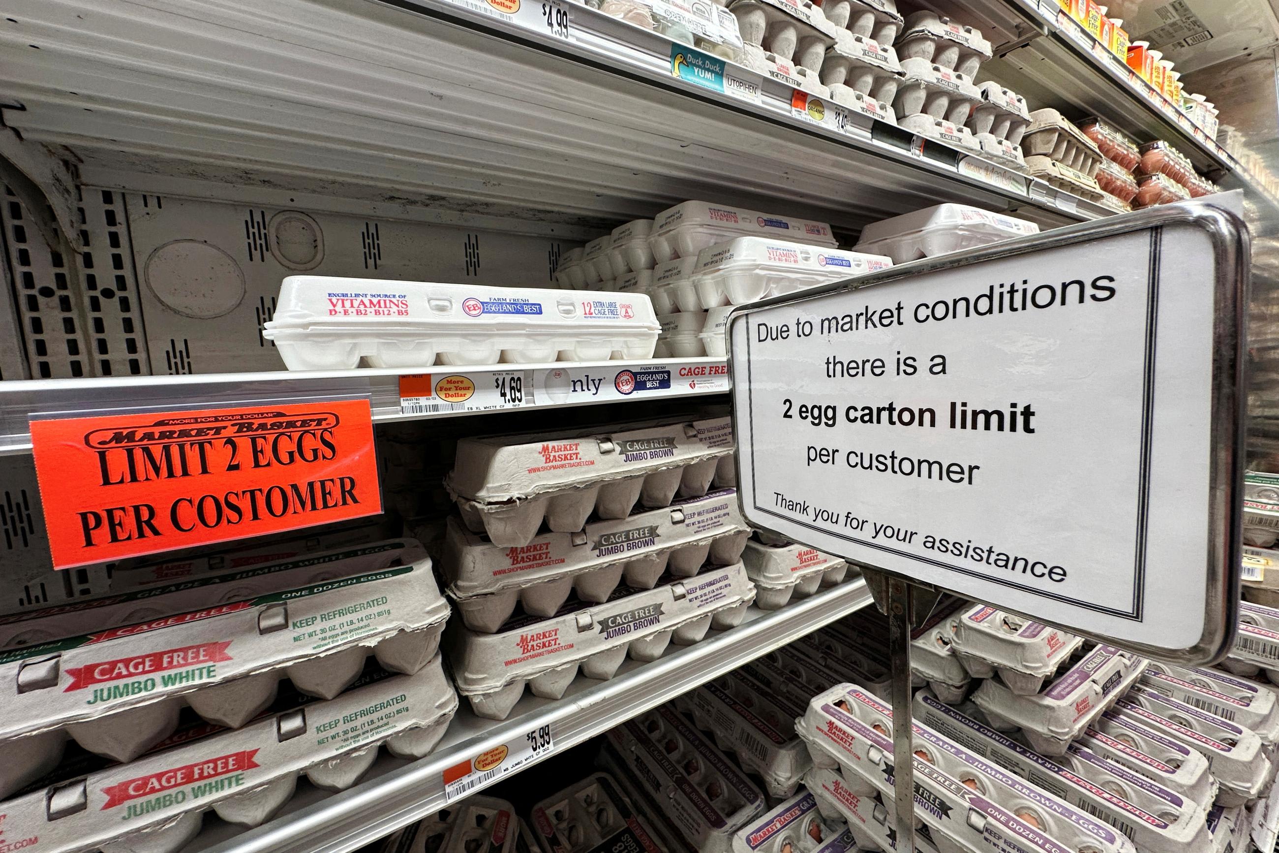 Signs limit the number of cartons of eggs a customer can purchase at a grocery store in Gloucester, Massachusetts, March 8, 2025.