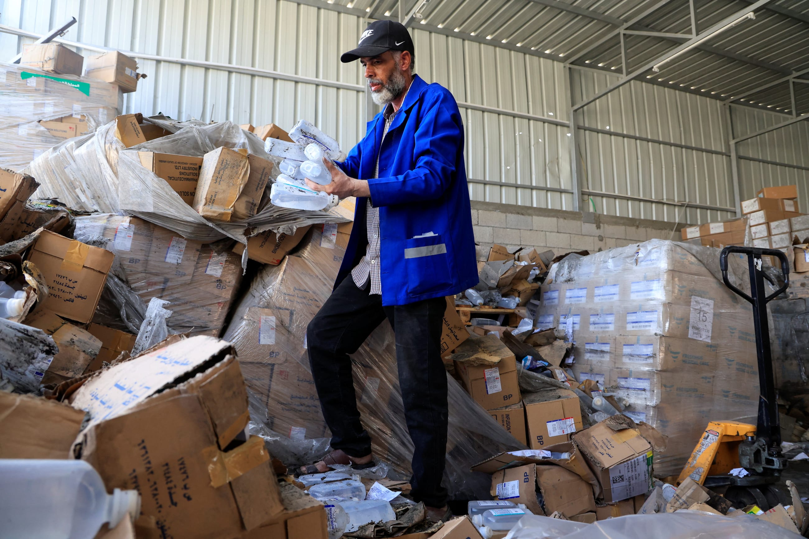 A Palestinian staff member inspects the medicine warehouse in Nasser Hospital after an Israeli strike, in Khan Younis, southern Gaza Strip, on May 19, 2025.