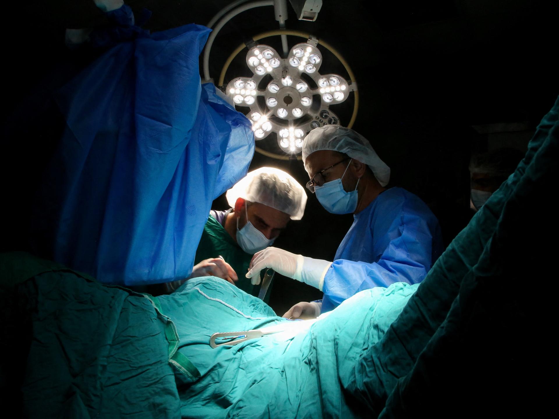 Medical personnel work in an operating room at Nasser Hospital, in Khan Younis in the southern Gaza Strip, on July 9, 2025.