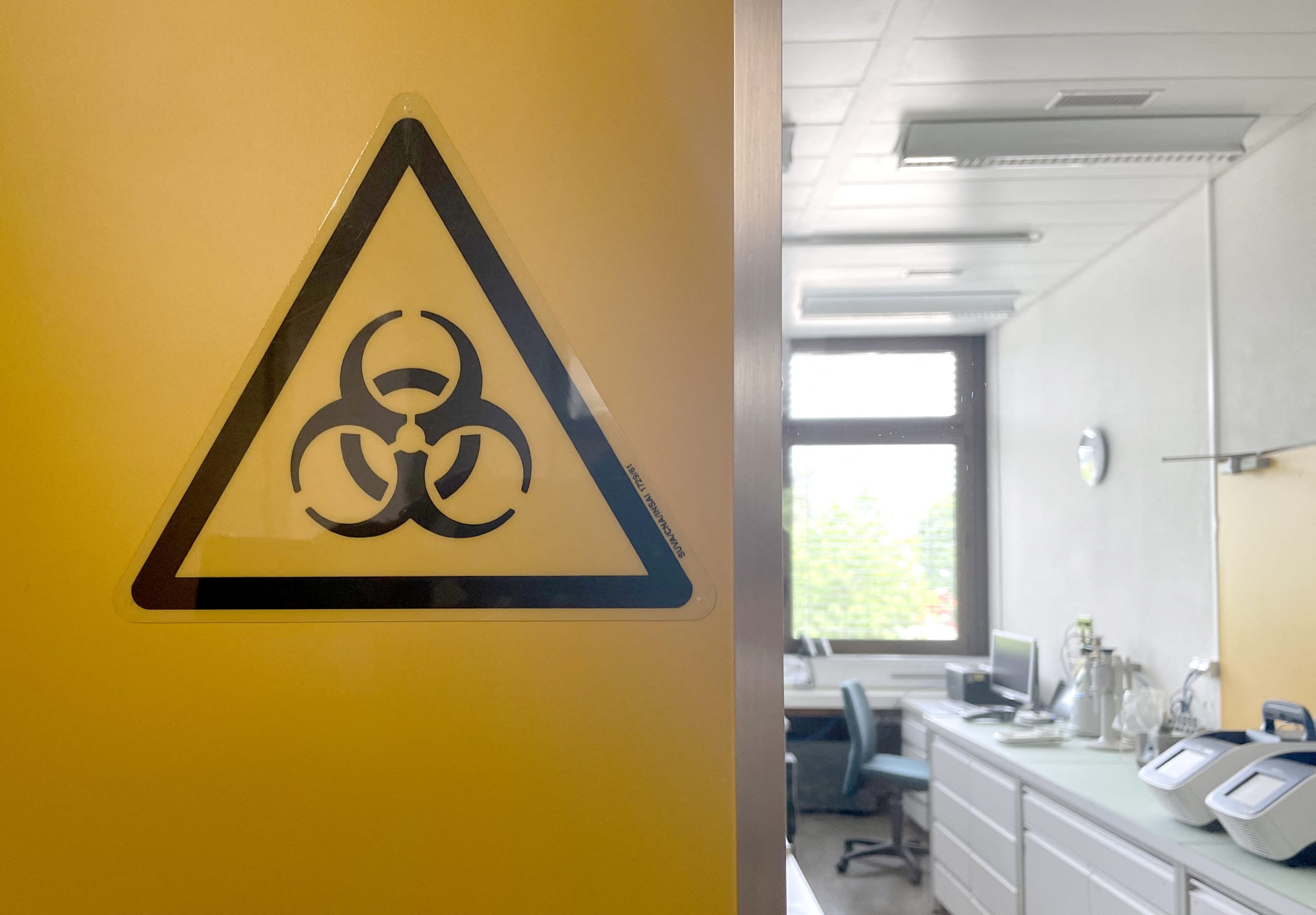 A biohazard sign is displayed in the biocontainment facility of the Spiez Laboratory, available to the World Health Organization as a repository for SARS-CoV-2 viruses or other pathogens with epidemic or pandemic potential, in Spiez, Switzerland, on June 8, 2022.