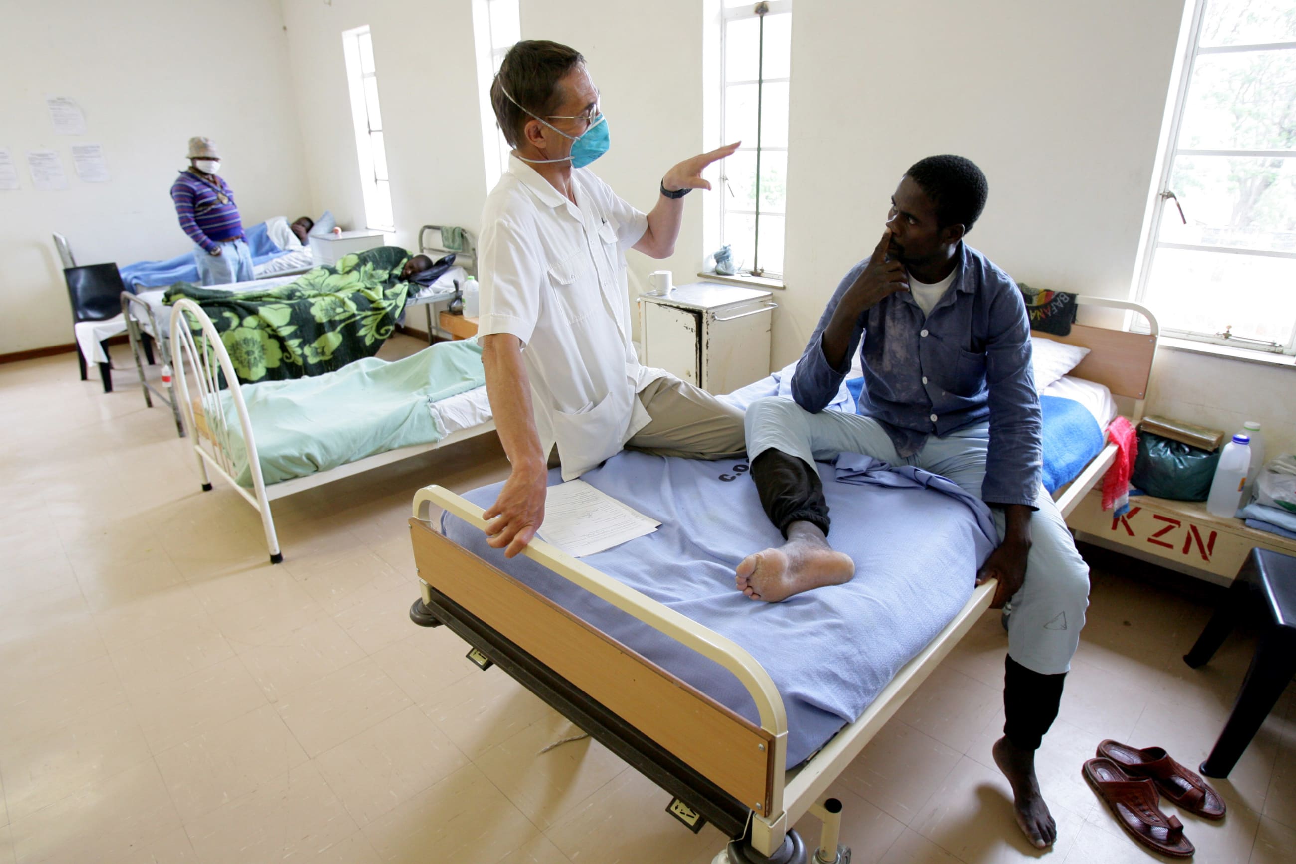 A health-care worker treats a tuberculosis patient at a rural hospital, at Tugela Ferry, KwaZulu Natal province, South Africa, on October 28, 2006.