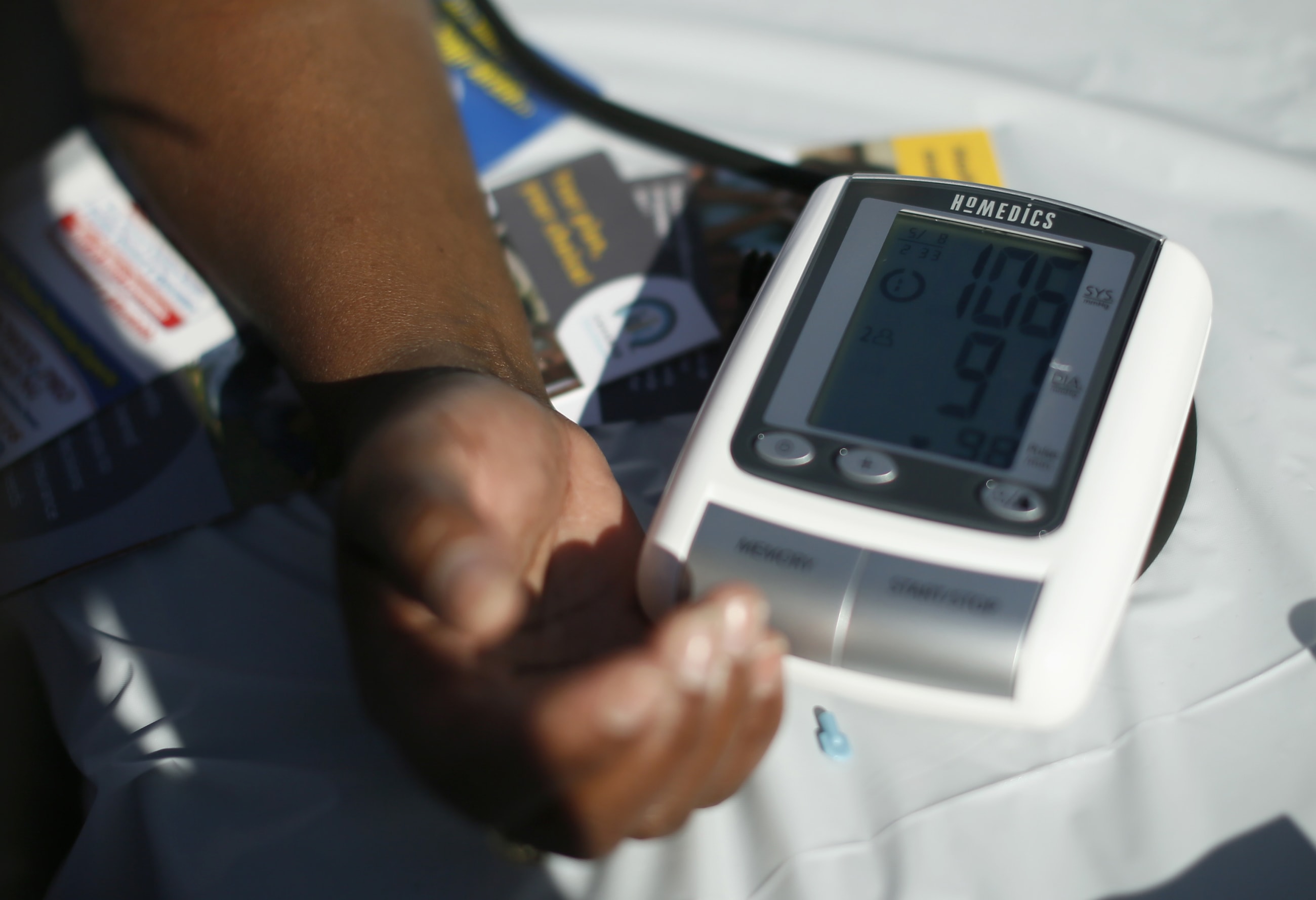 A participant's blood pressure is measured at an event to inform people about the Affordable Care Act, in Los Angeles, California, on November 25, 2013.
