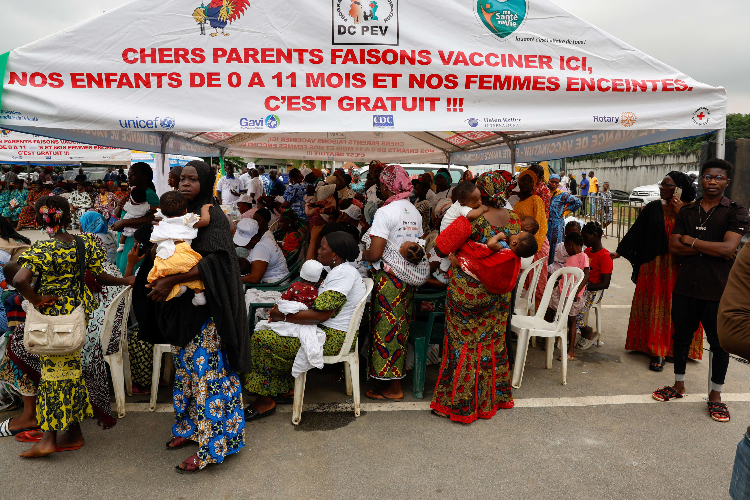 Women wait to have their children vaccinated during a malaria vaccination campaign for children aged between zero and eleven months, in Abobo a district of Abidjan, Ivory Coast, on July 15, 2024.