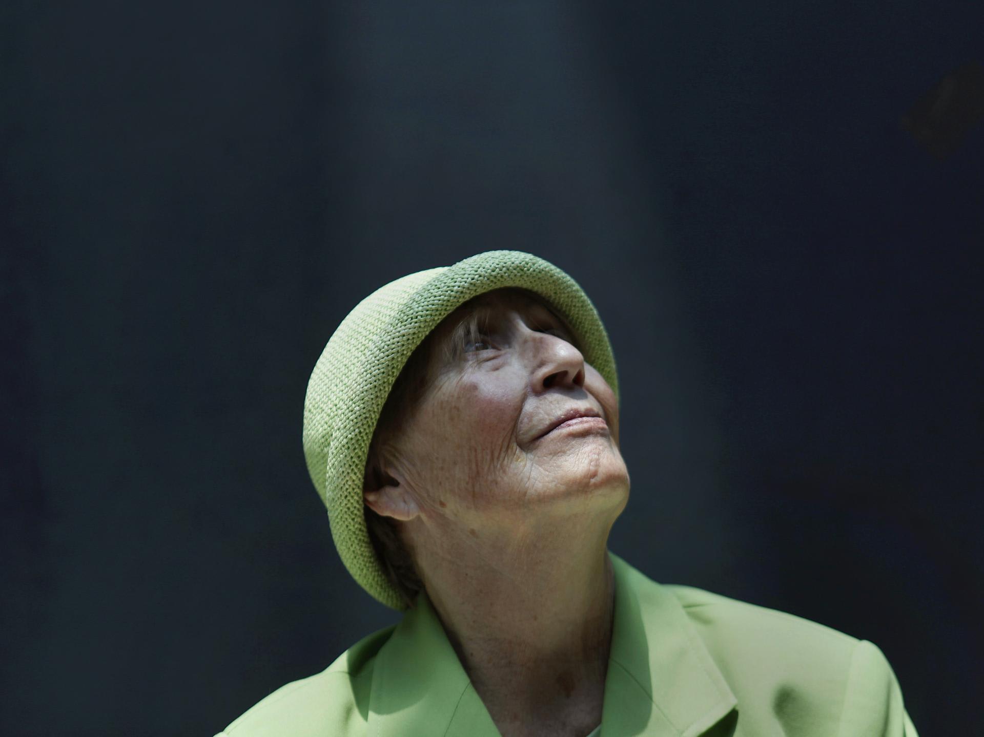 Teresa, 75, an Alzheimer's patient and former businesswoman, poses for a photograph inside the Alzheimer Foundation, in Mexico City, Mexico, on April 19, 2012.