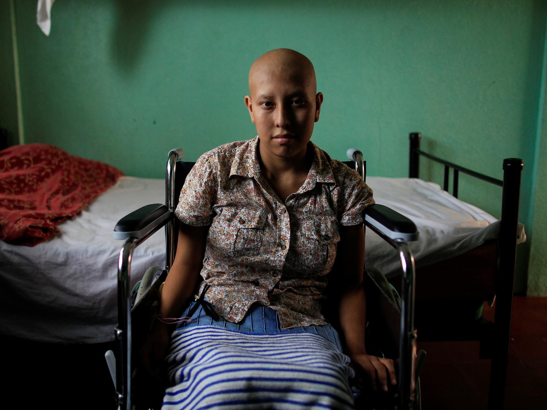 Norma del Carme Blandin, a cancer patient, sits in a wheelchair inside her bedroom, at the Casa-Albergue, in Managua, Nicaragua, on October 20, 2017.