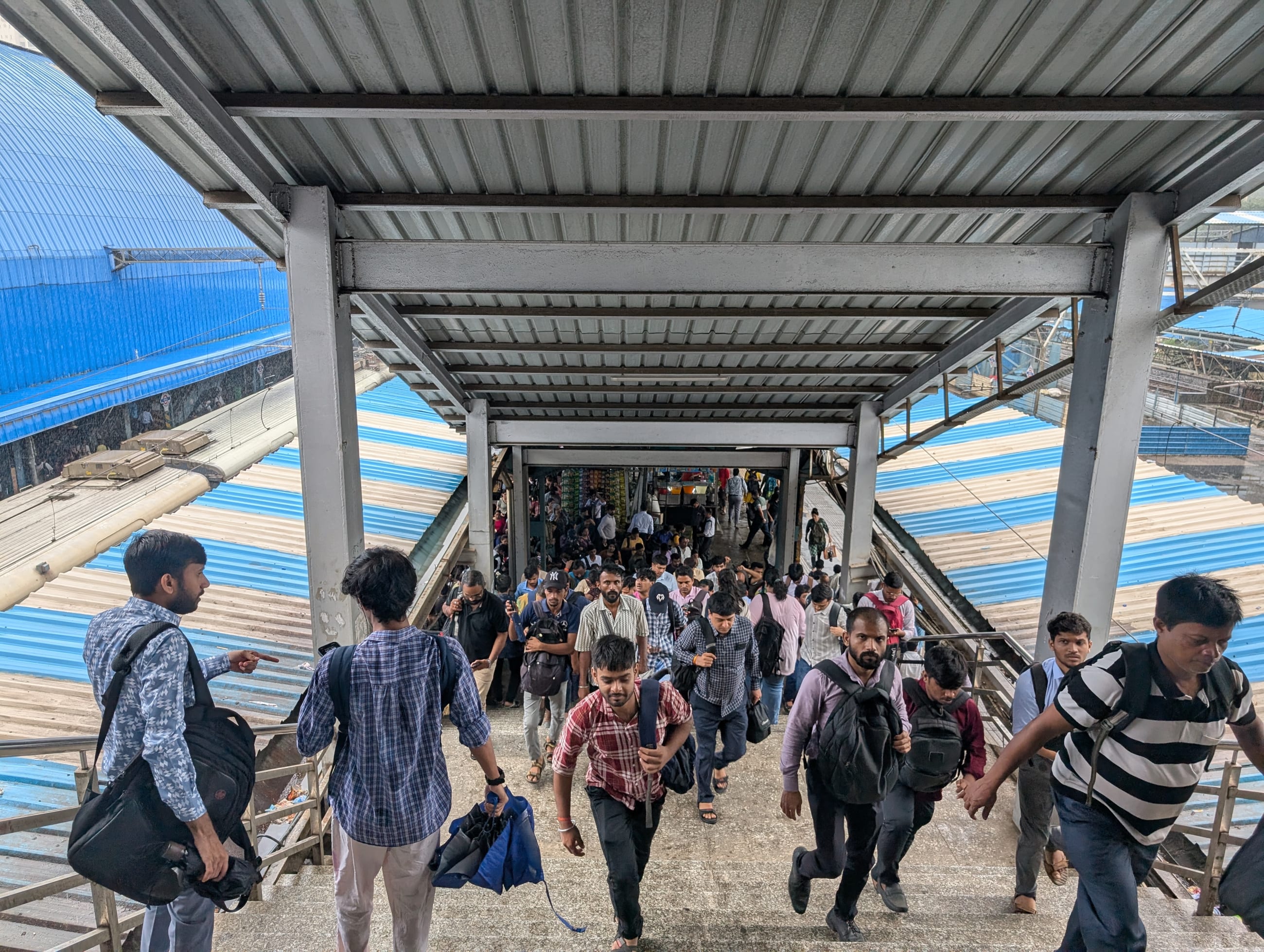 Train commuters at Goregaon railway station in suburban Mumbai, India, on August 7, 2025.