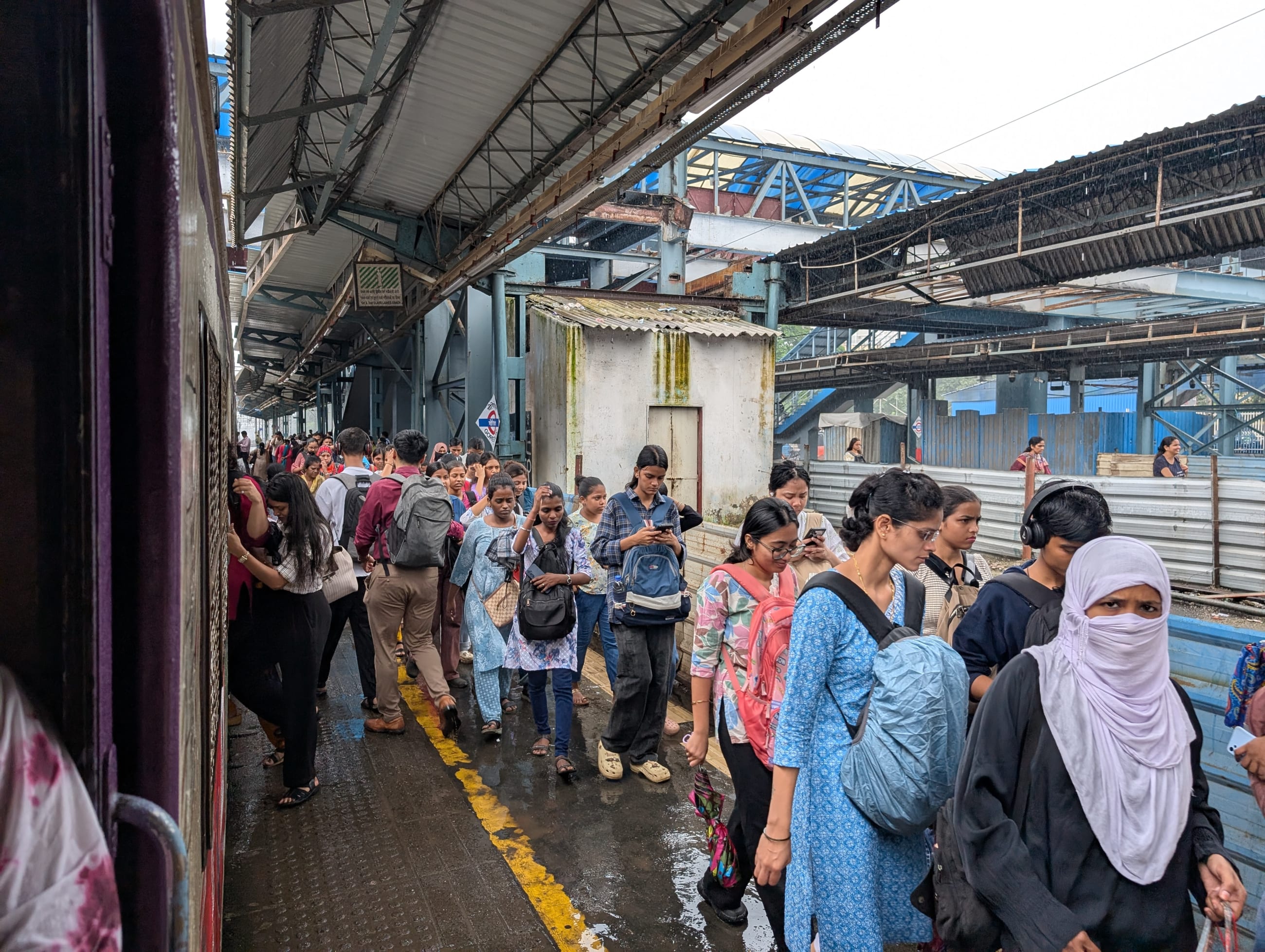 Train commuters at Goregaon railway station in suburban Mumbai, India, on August 7, 2025.