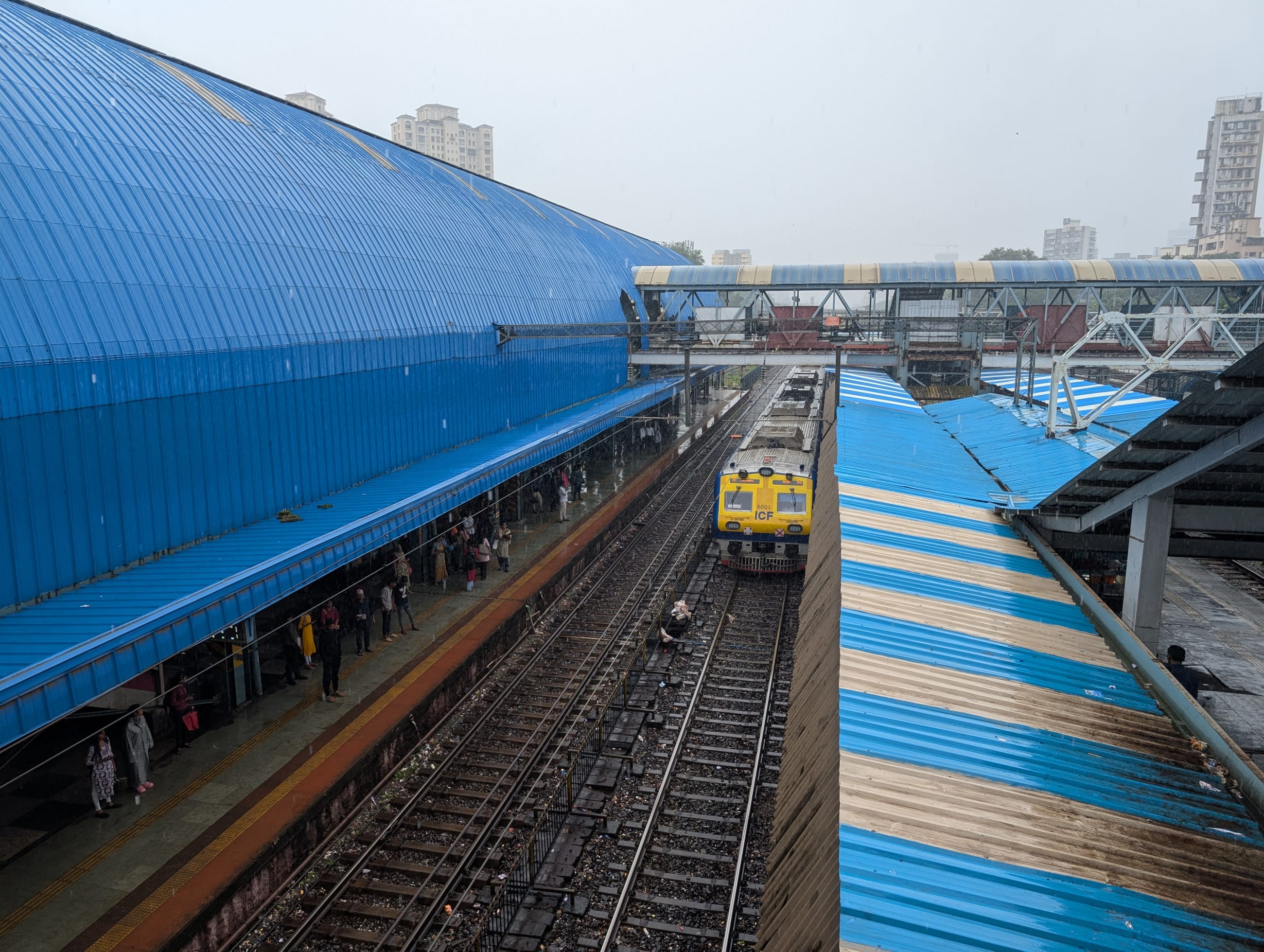 A train approaching Goregaon railway station in suburban Mumbai, India, on August 7, 2025.