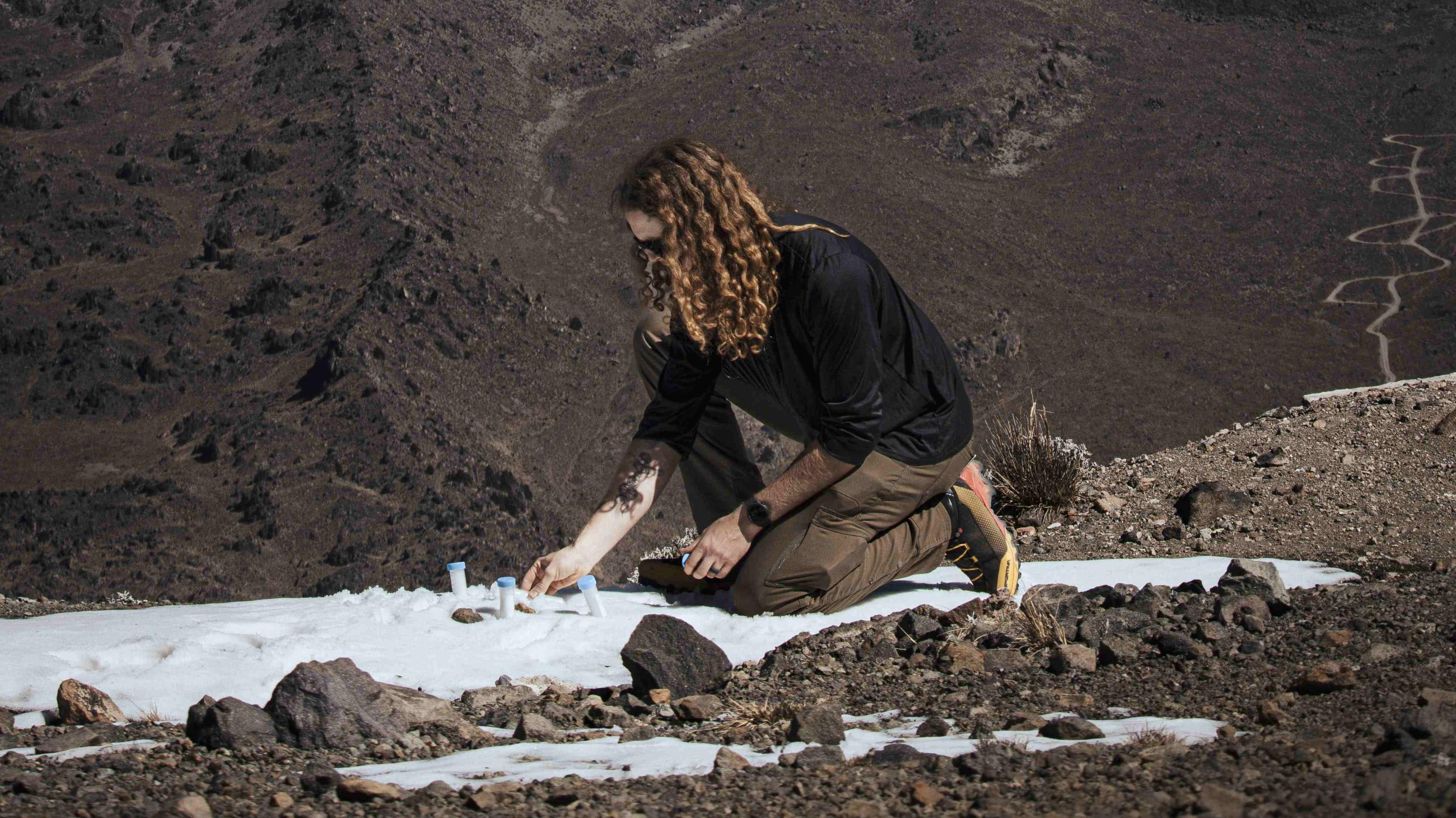 A researcher takes samples at Sierra Negra.