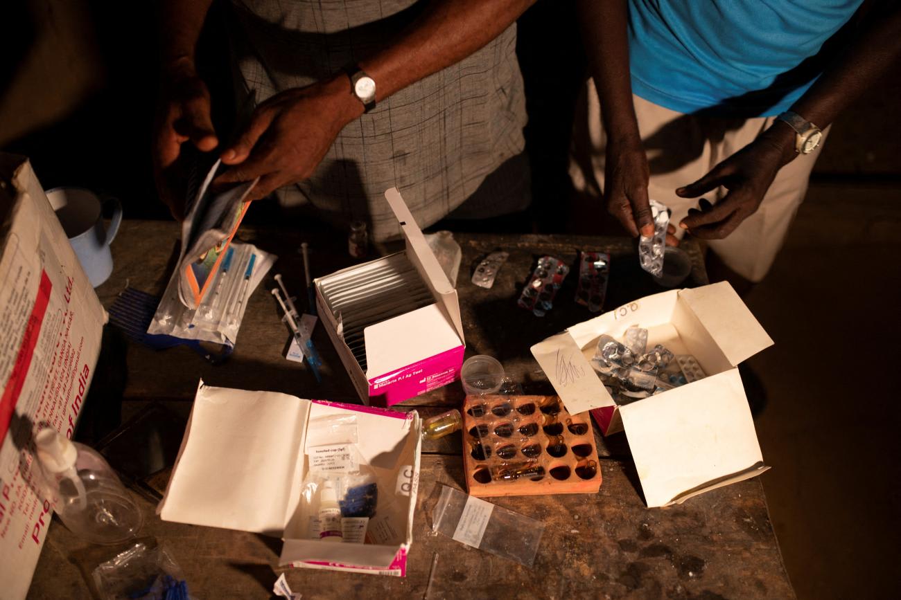 Nurses arrange medicine on a table, at the Yalanga health centre in Democratic Republic of Congo, October 2, 2022.