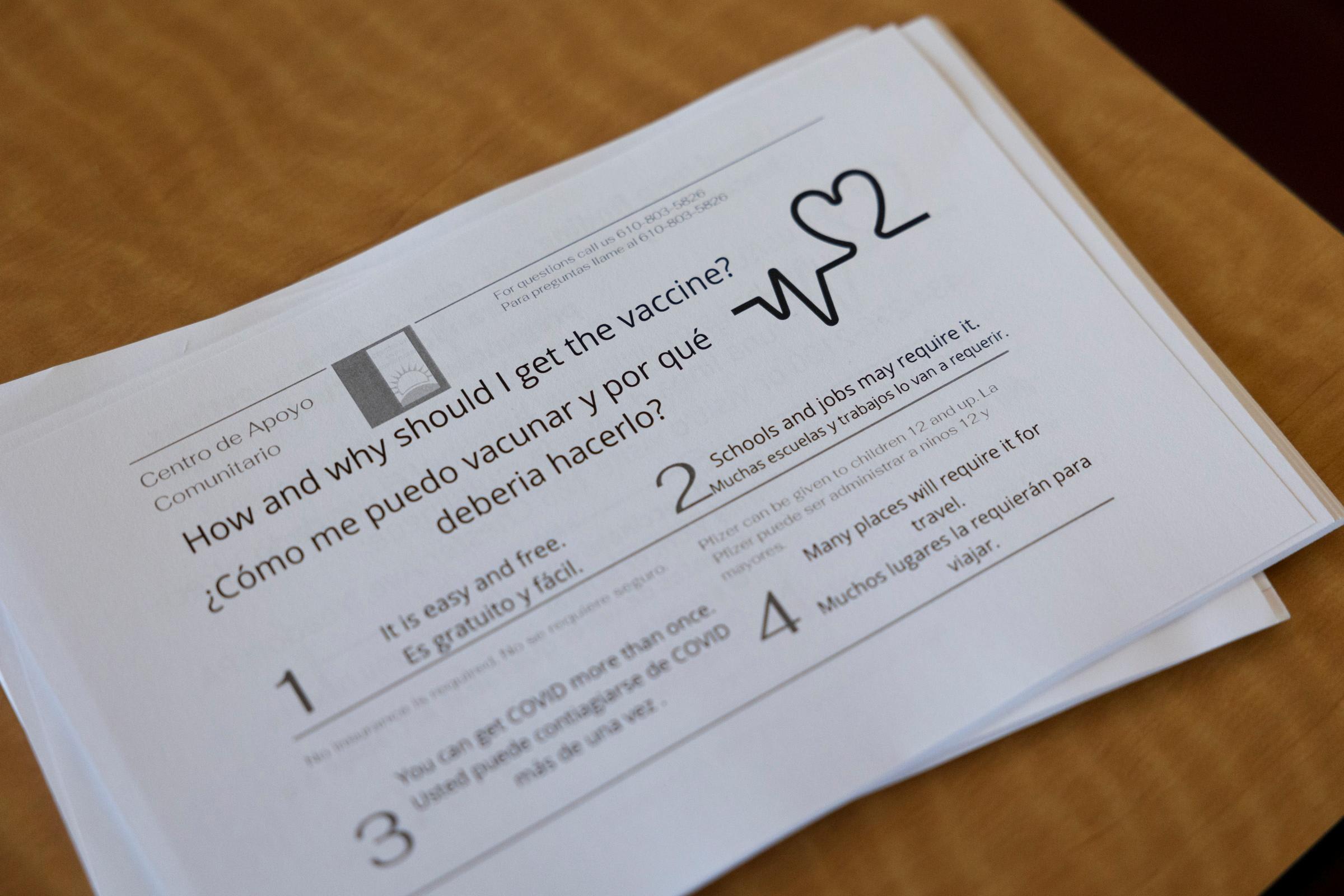 Members of Unidos Contra COVID promote vaccinations within the Latino community during an outreach event.